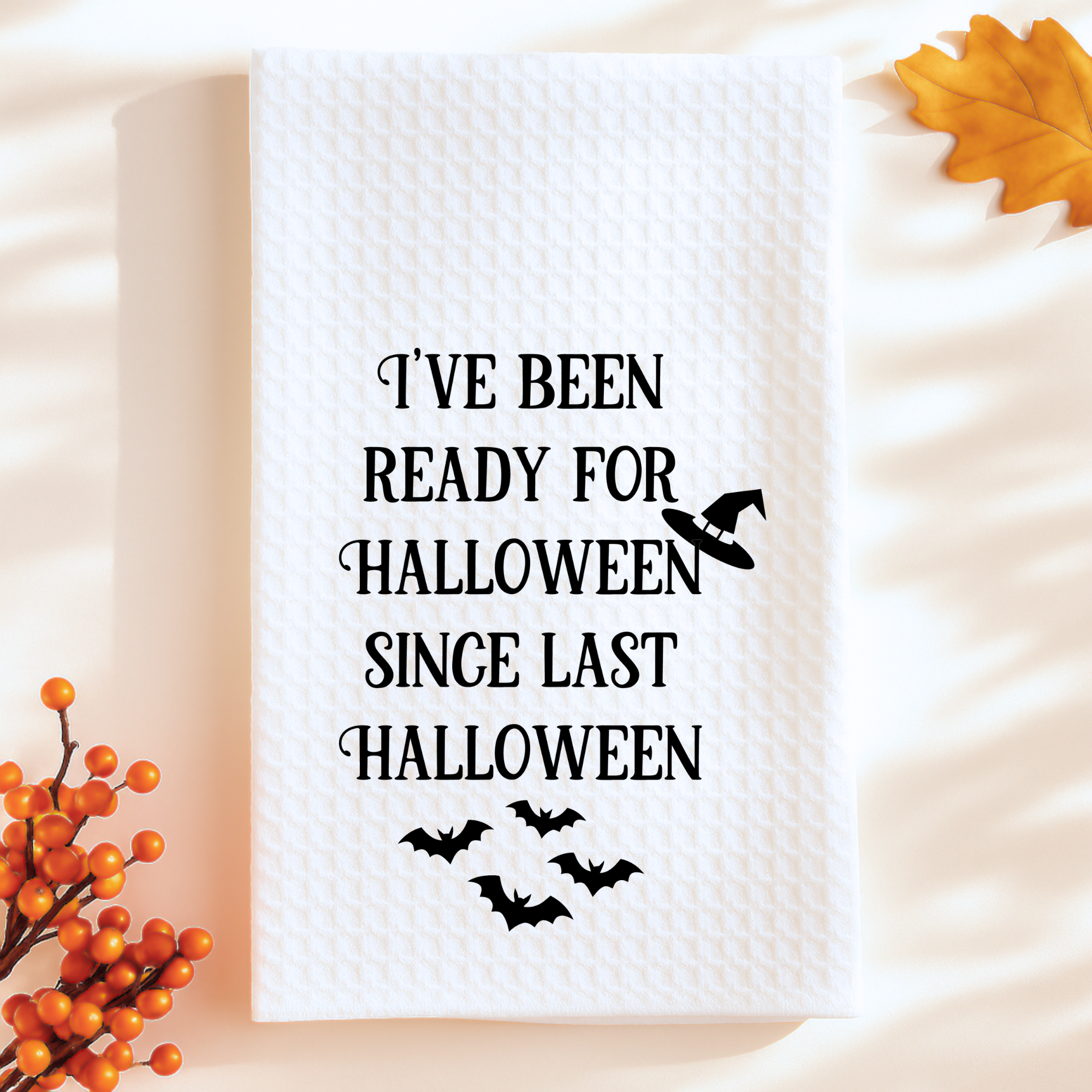 Funny Halloween waffle weave towel with witch hat and bats, spooky kitchen decor gift.