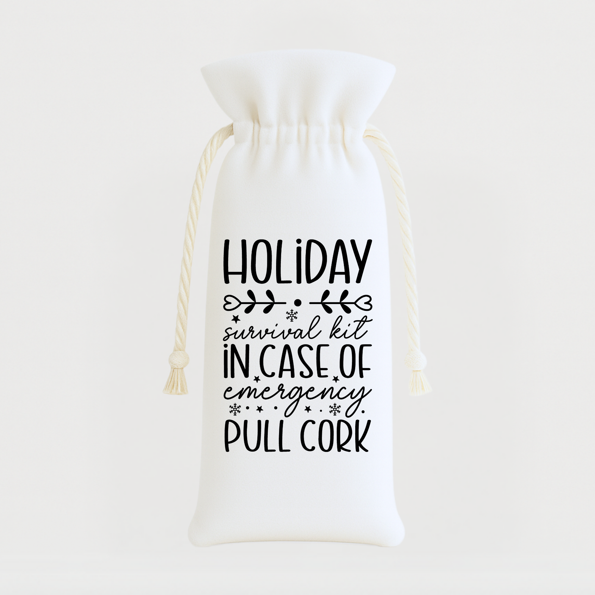Funny “Holiday Survival Kit – In Case of Emergency Pull Cork” wine bag with black lettering on white fabric.