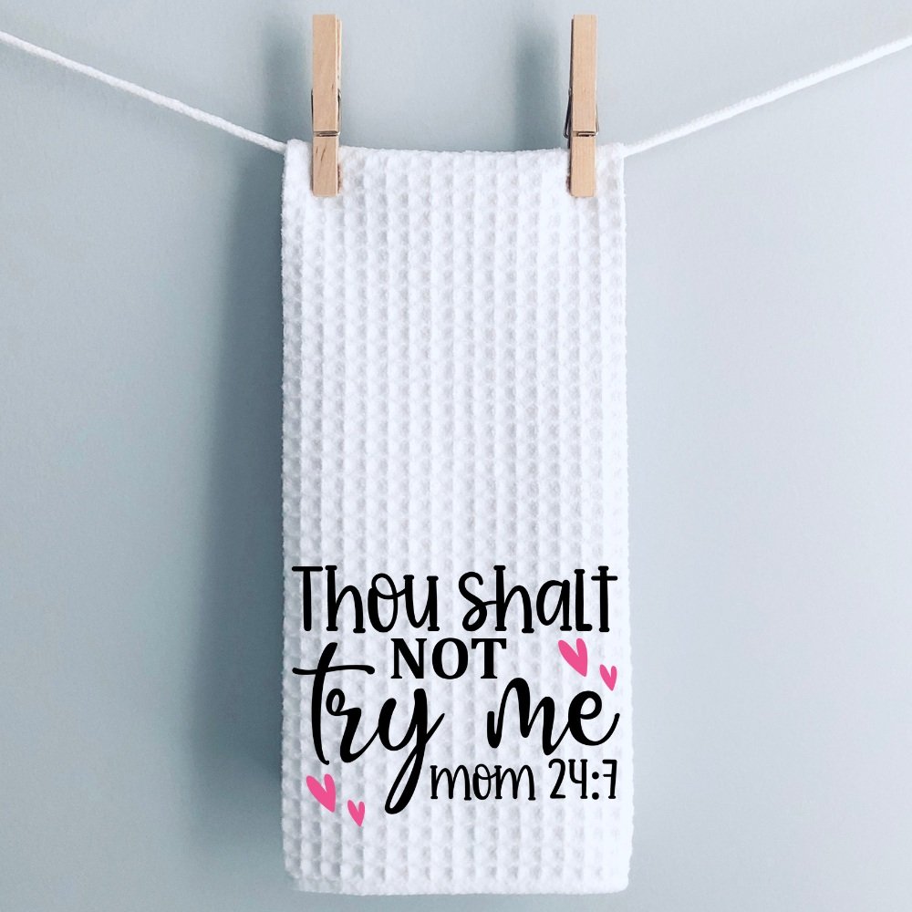 Sassy mom kitchen towel draped over a wooden board with red striped dish towels. A fun and functional gift for Mother's Day or birthdays.