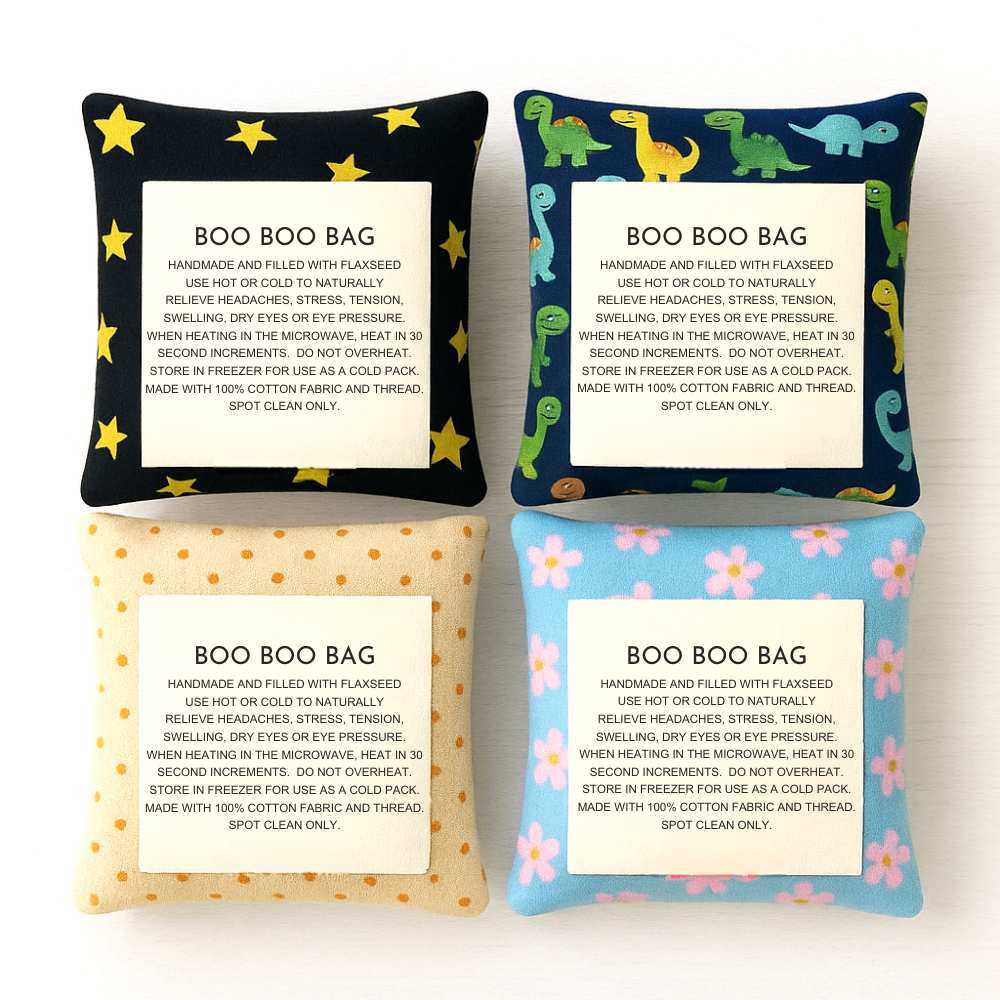 Assorted Boo Boo Bags with playful stars, dinosaurs, polka dots, and pastel flowers on a white background.