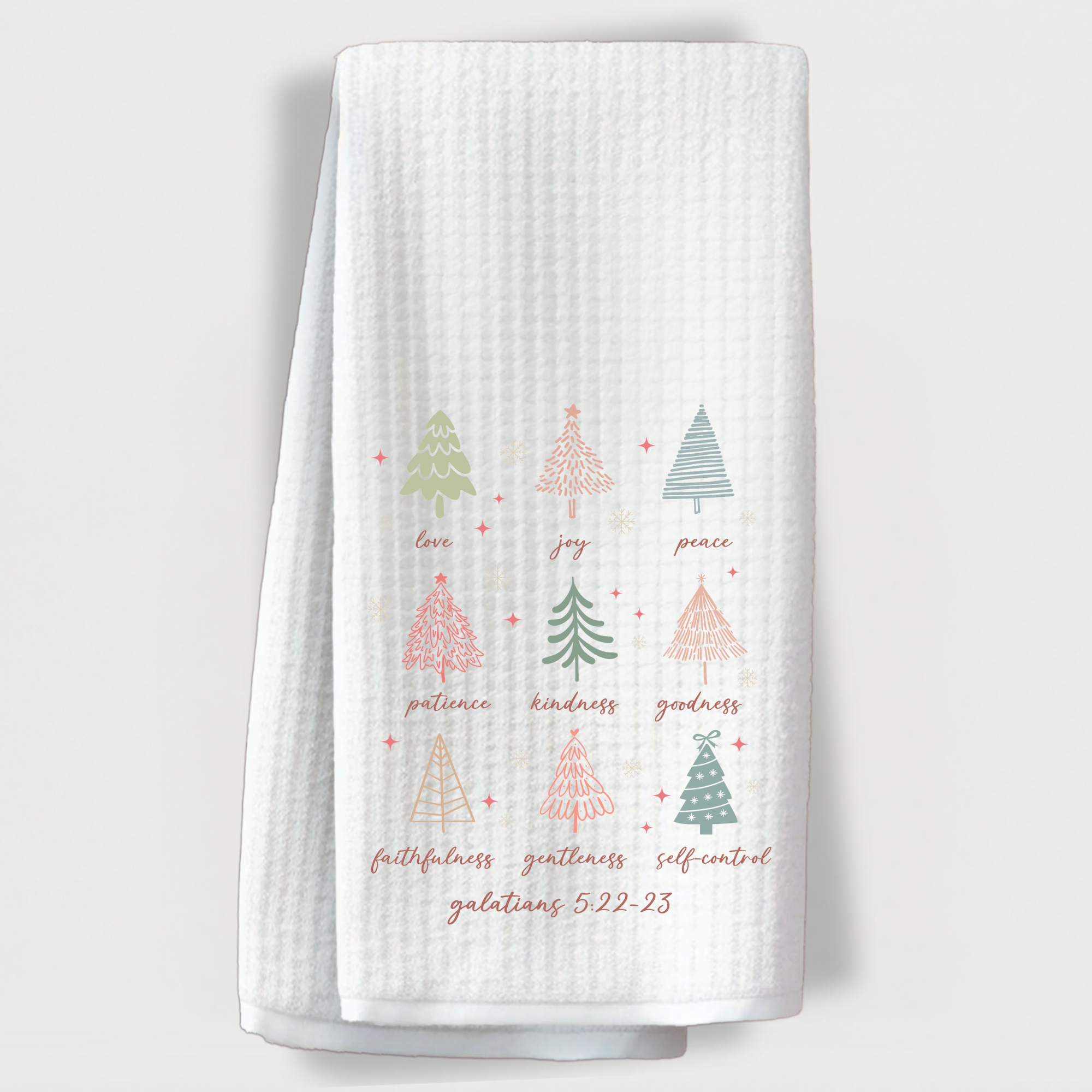 White waffle weave towel with pastel Christmas trees and Galatians 5:22-23 Bible verse.