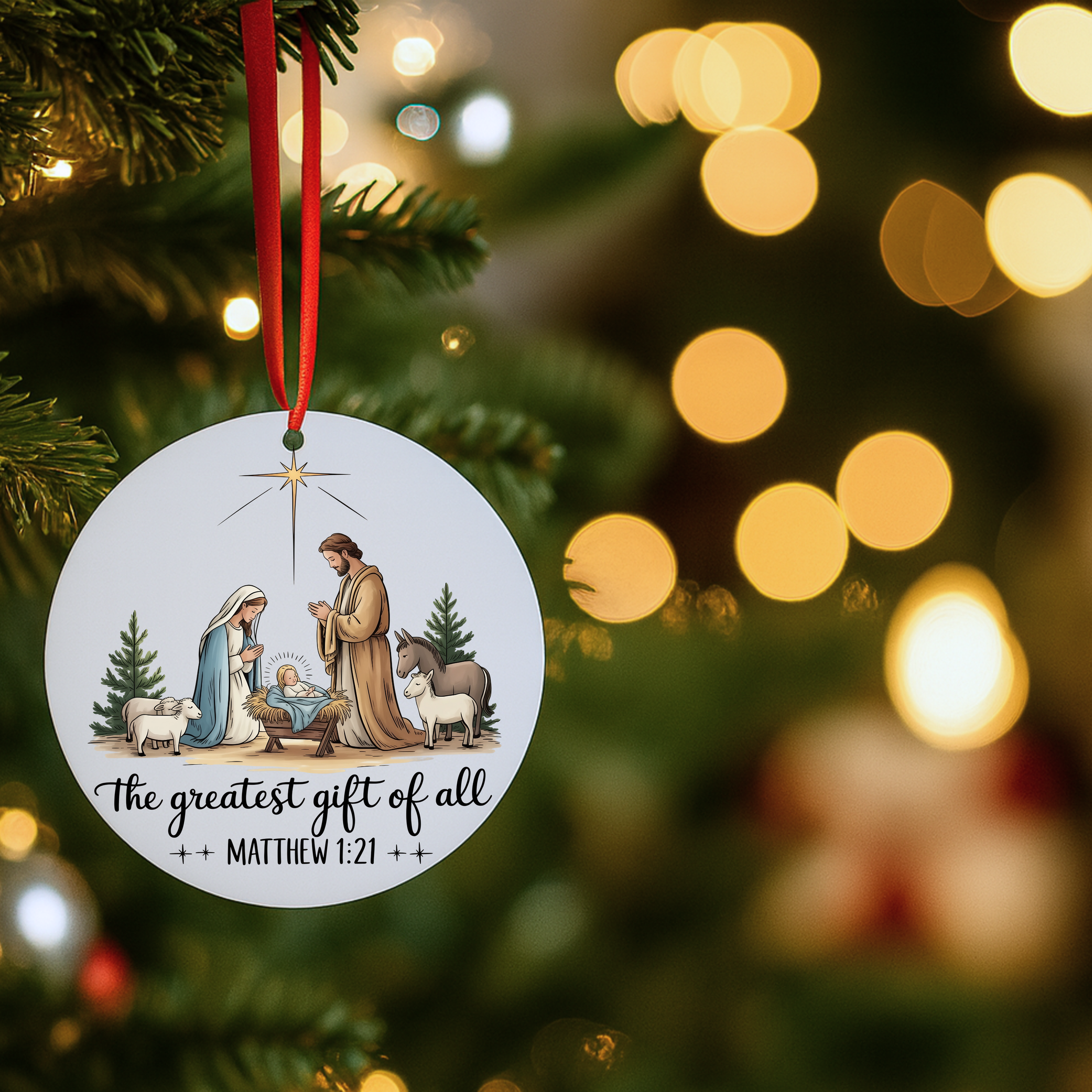 Christian nativity ornament hanging on a Christmas tree with warm bokeh holiday lights.