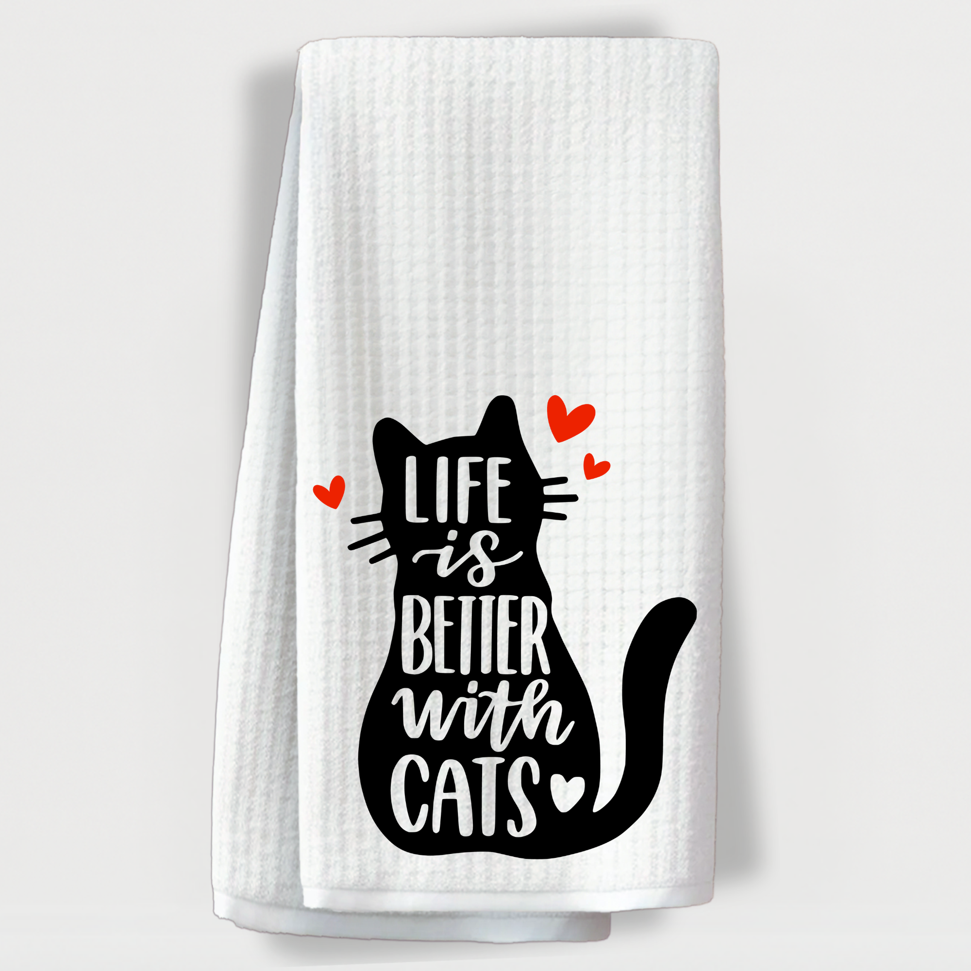 Cat lover towel with a silhouette of a cat and the quote 'Life is better with cats' surrounded by red hearts.