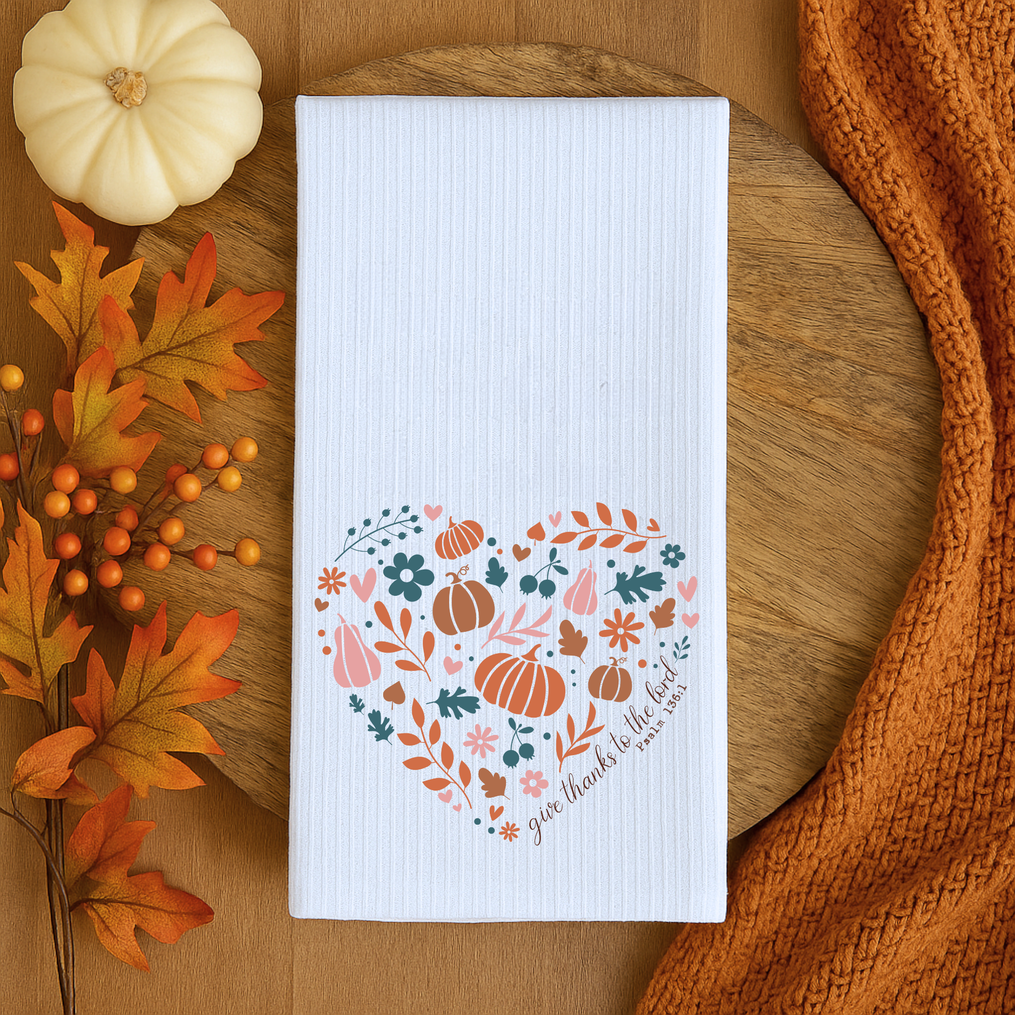 Christian Thanksgiving kitchen towel on wood tray with pumpkin, leaves, and fall farmhouse decor.