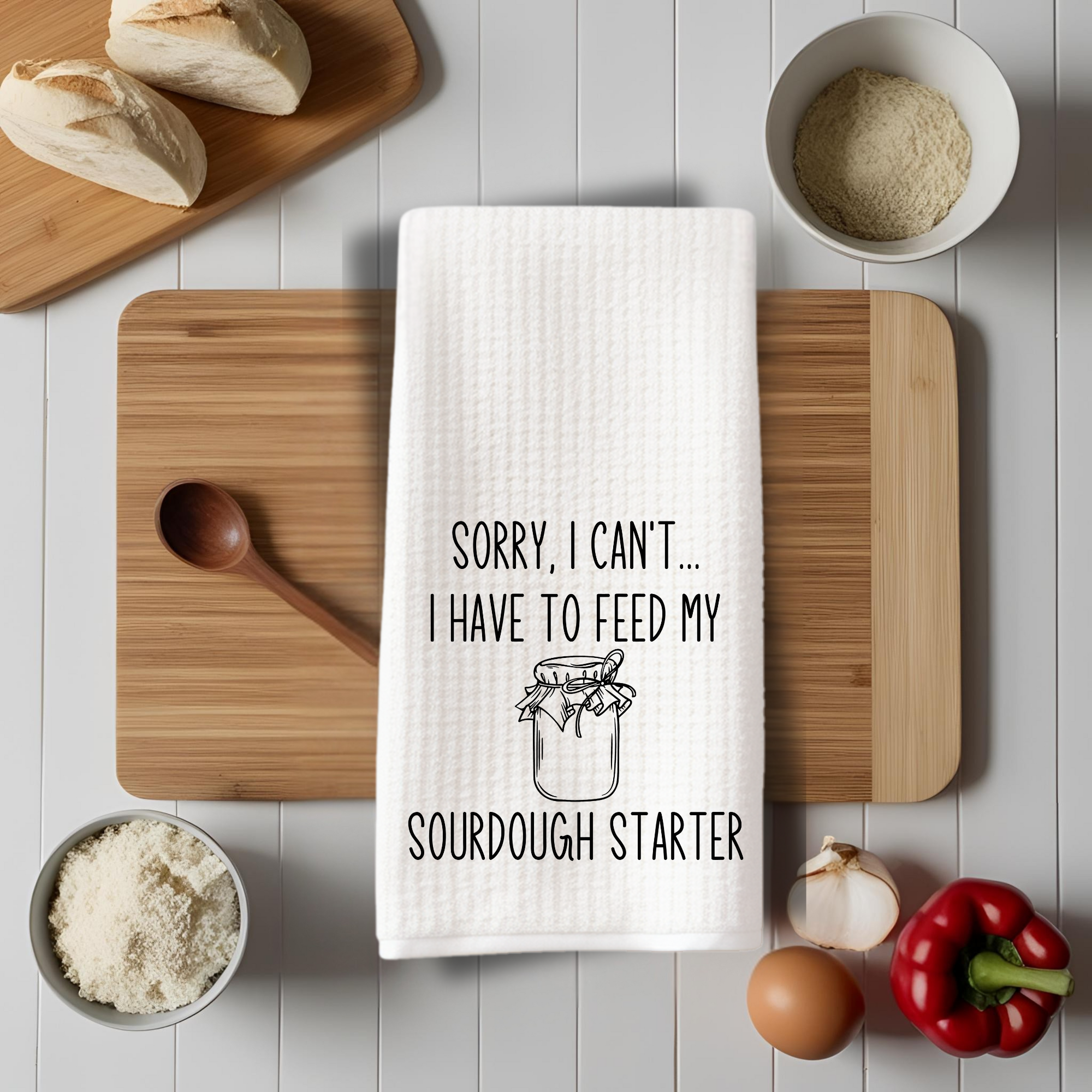 Baking towel with sourdough quote styled on cutting board with ingredients – farmhouse kitchen decor.