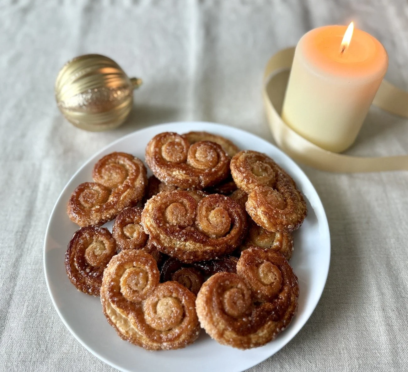 Cinnamon Sugar Palmiers (dozen) - Crisp pastry hearts rolled in fragrant cinnamon–vanilla sugar. $30