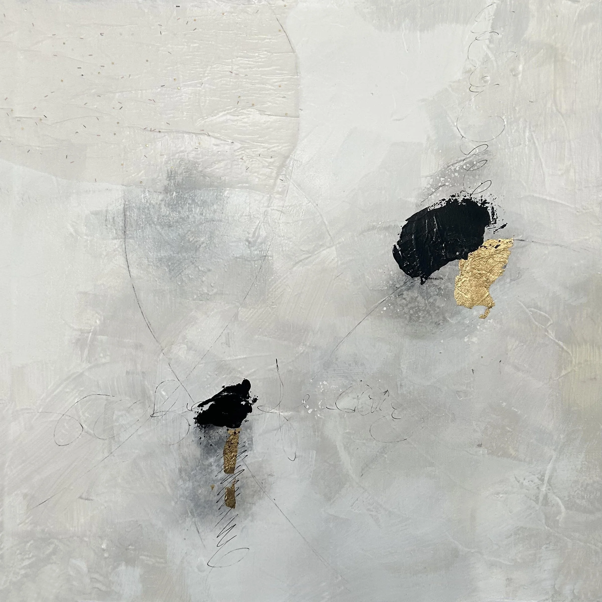 Abstract art featuring white, black, and gold textured paint strokes with small decorative elements on a gray background.