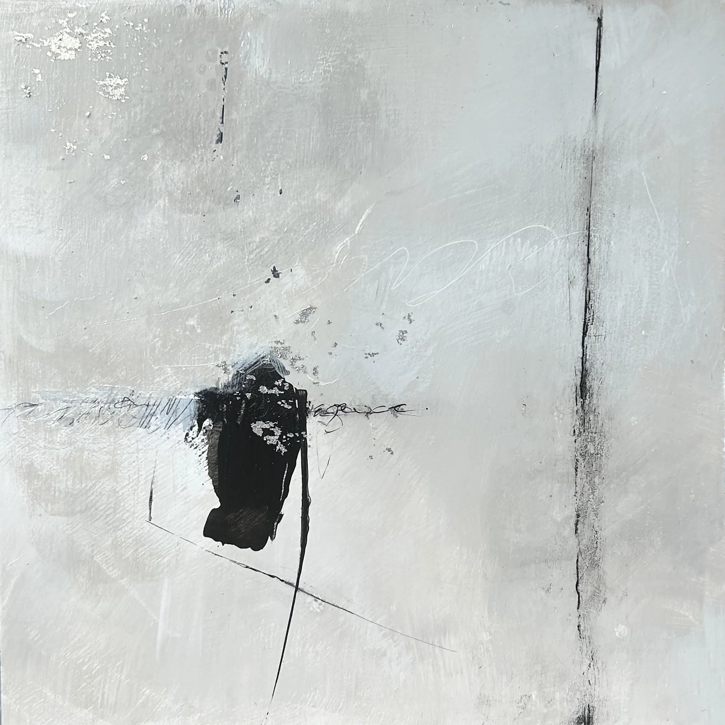 Abstract black ink splatters on a white wall with some scratches and uneven texture.