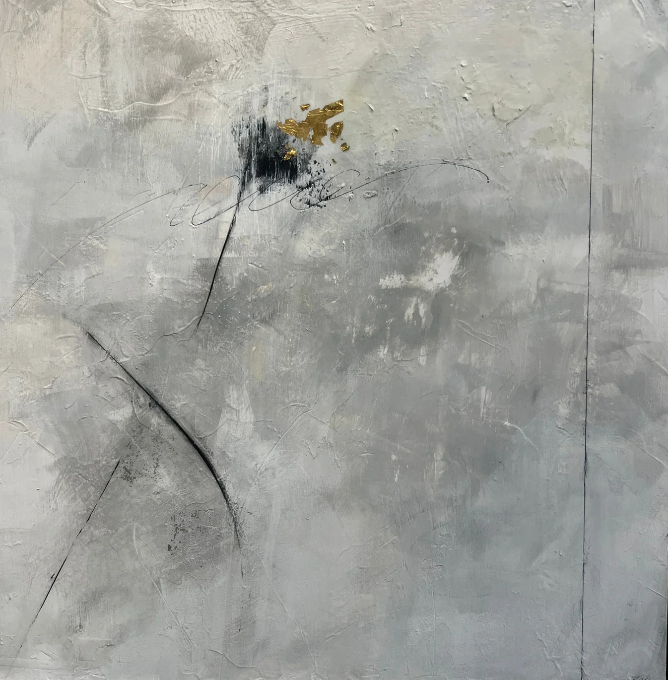 Abstract textured wall with gray, black, and gold paint, and random black lines and cracks.