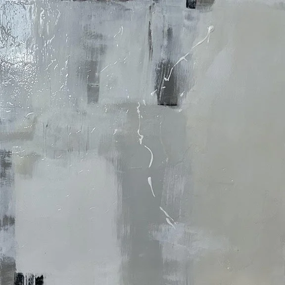 Close-up of a scratched and painted wall with visible streaks and imperfections.
