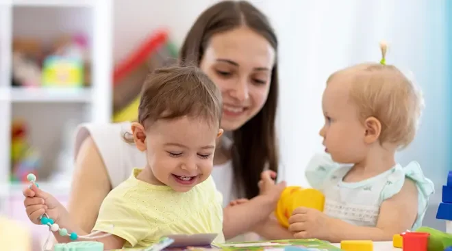 Mother navigating the daycare drop-off with two children, managing the emotional transition of returning to work.