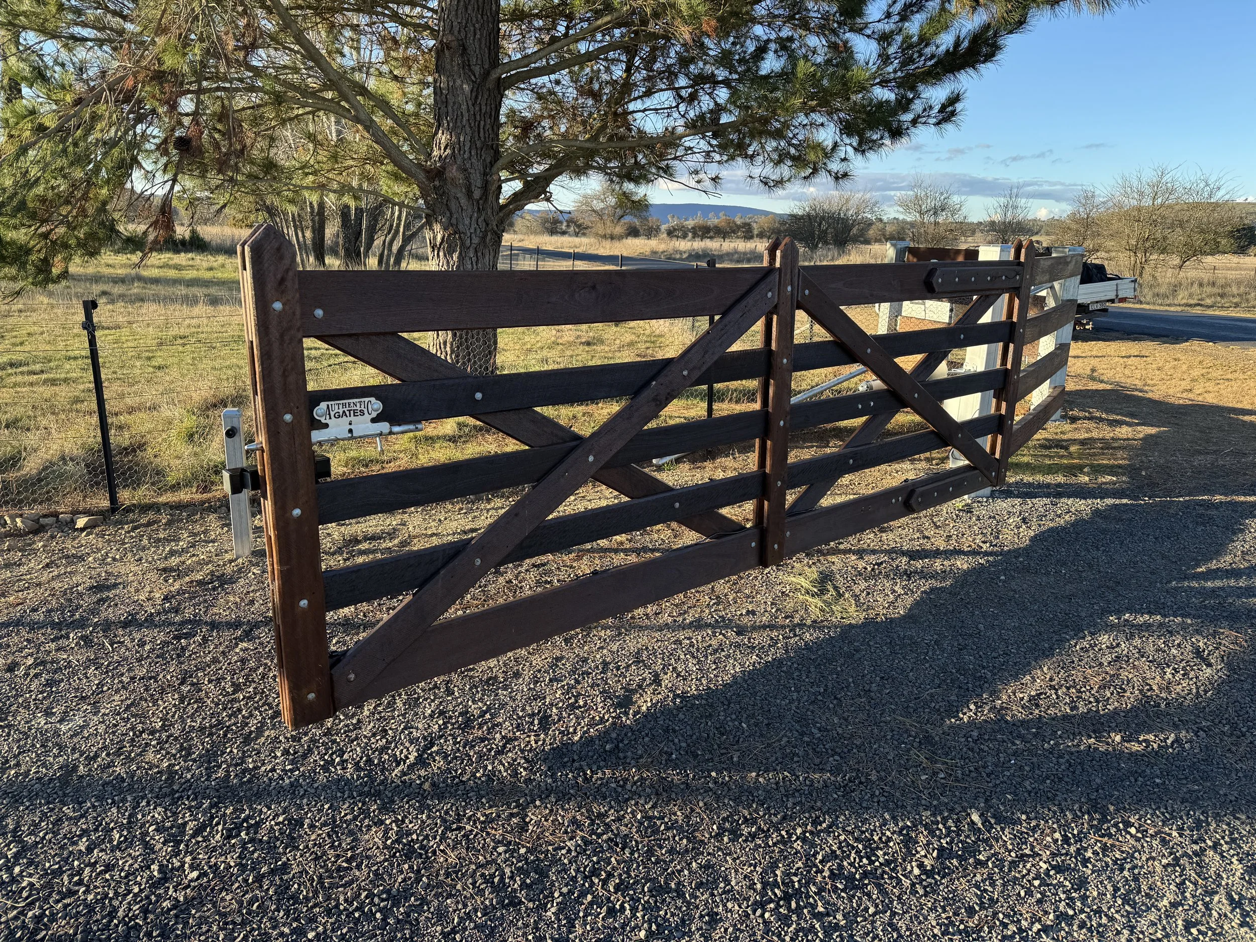 Gate half open showing gate logo Authentic gates.JPG