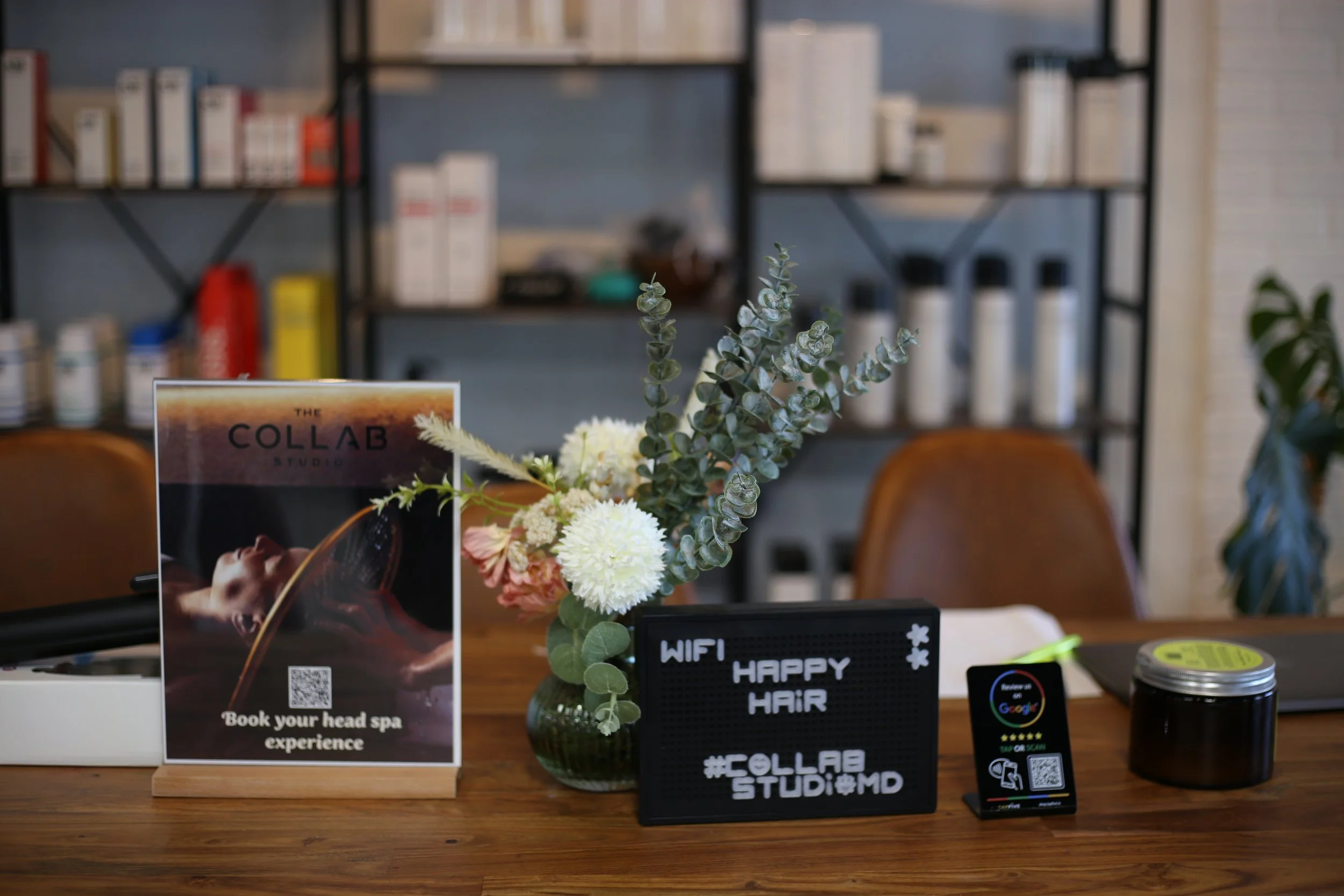Close-up of a computer screen displaying a design or mockup project with a person in the foreground.