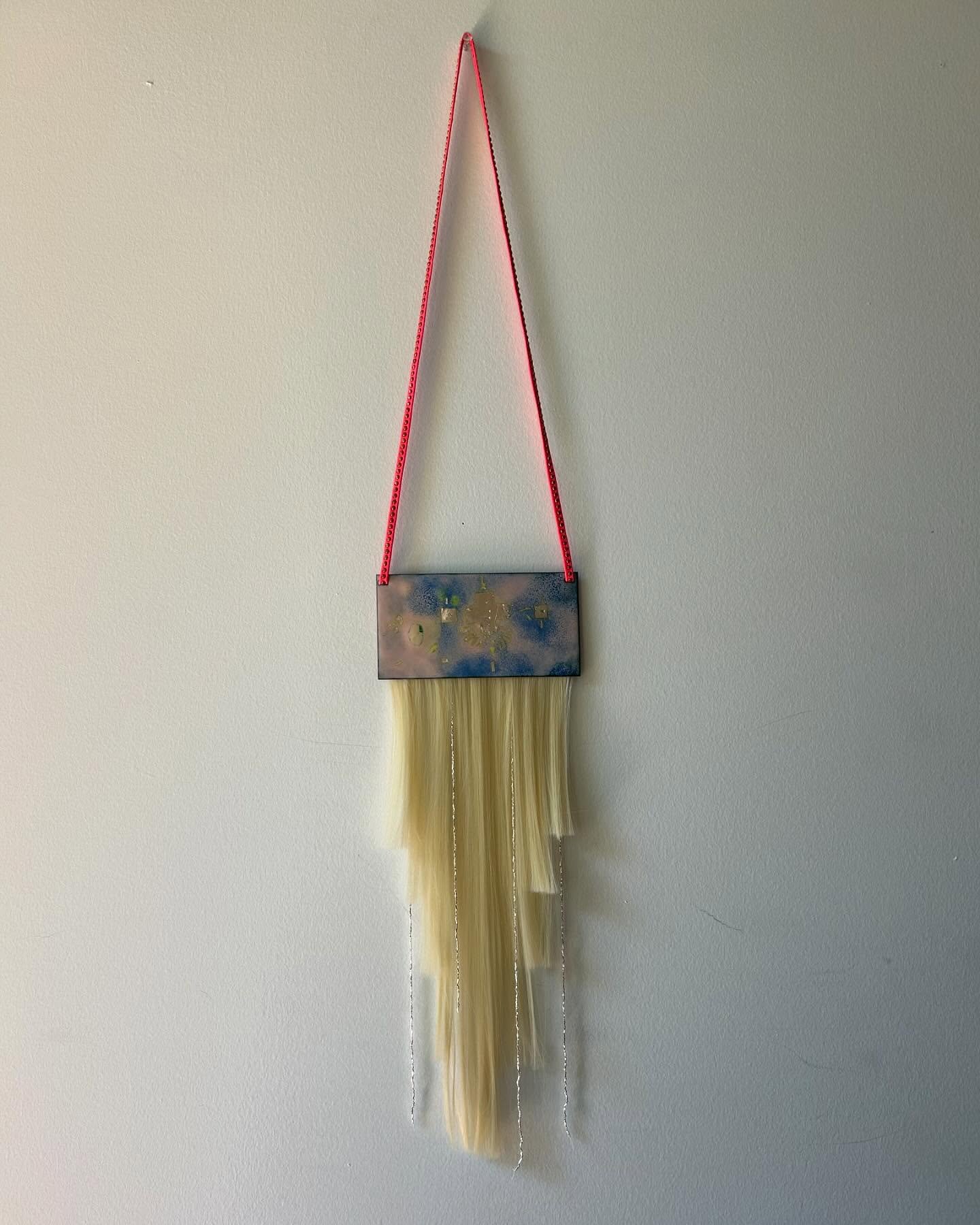 art school was fun

last project a wall hanging piece I made from enameling and fake hair w/ studded leather cord!