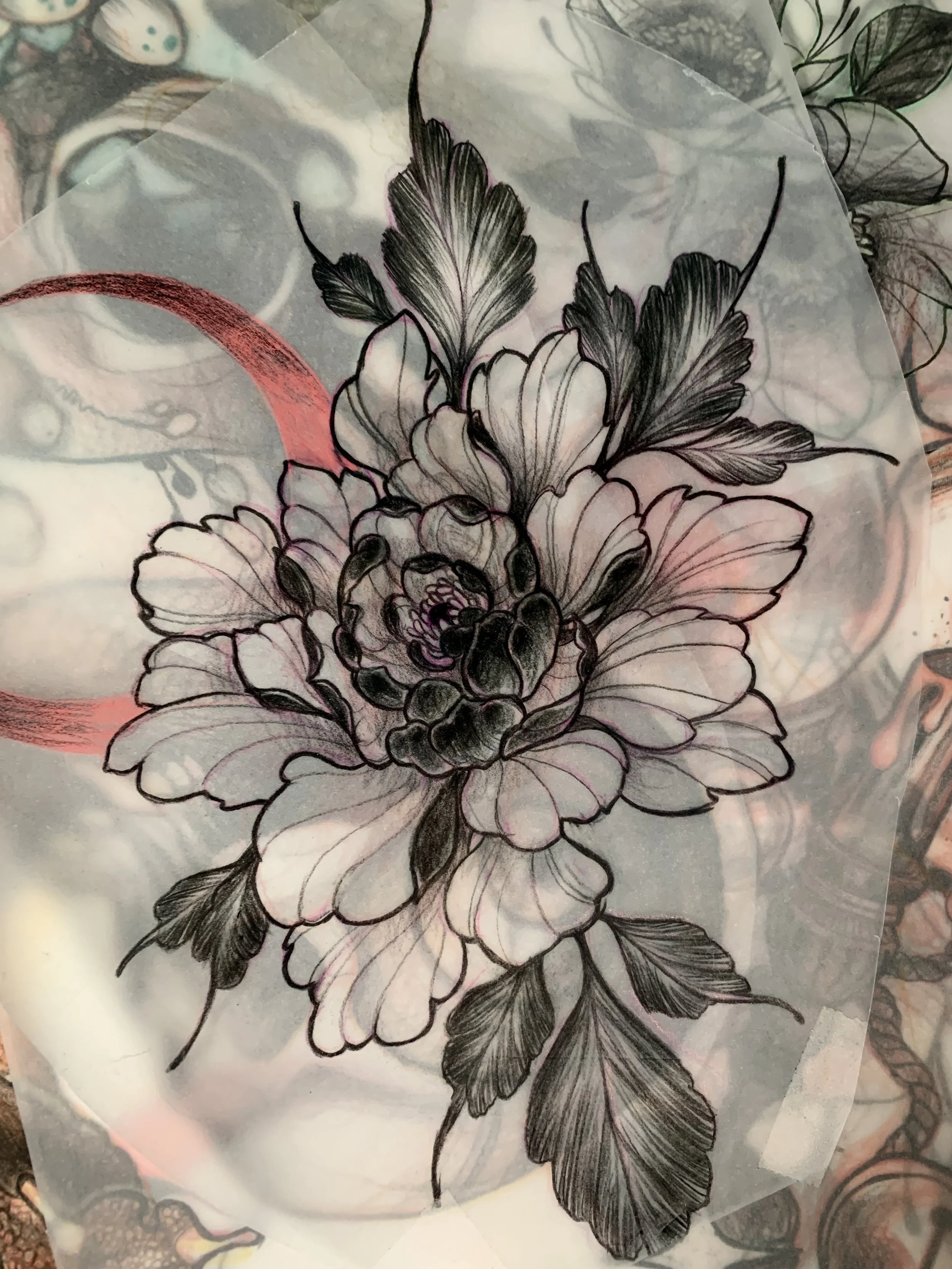Black and white floral tattoo design of a peony with leaves.
