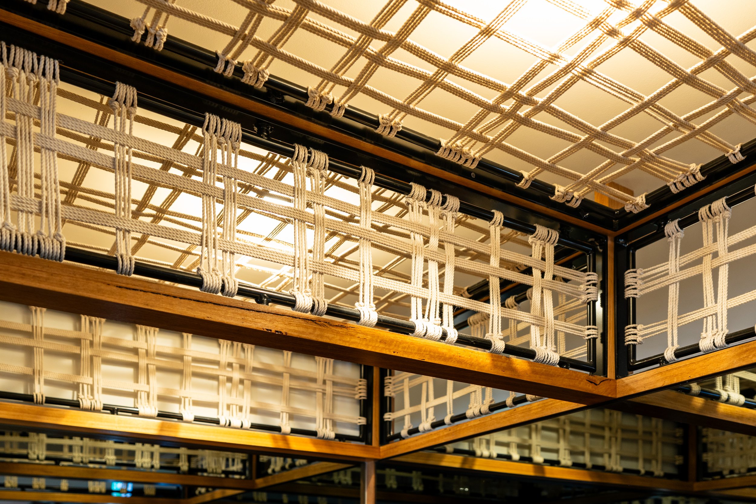 Ceiling with decorative latticework made of ropes and wooden frames