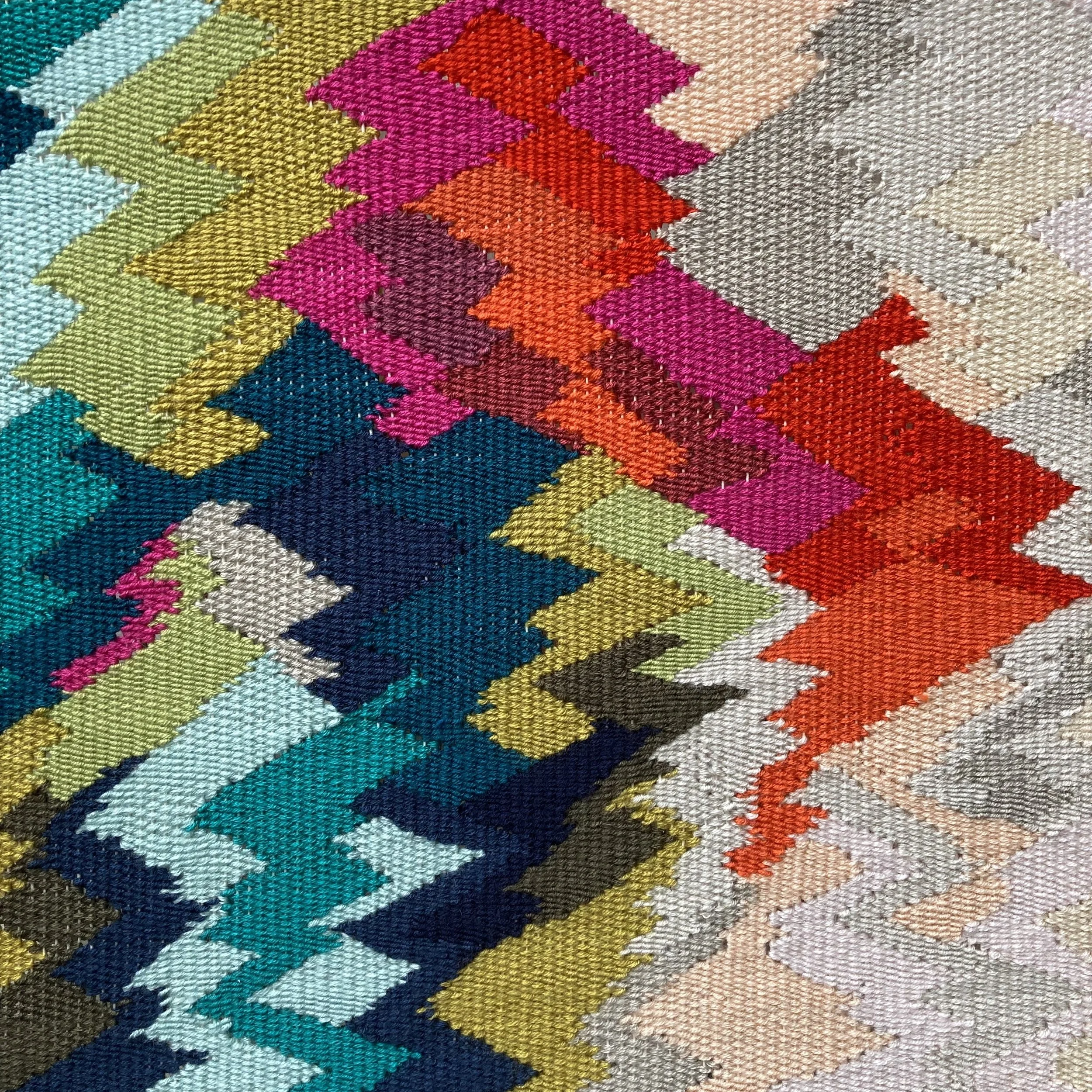 Colorful zigzag pattern on textured fabric