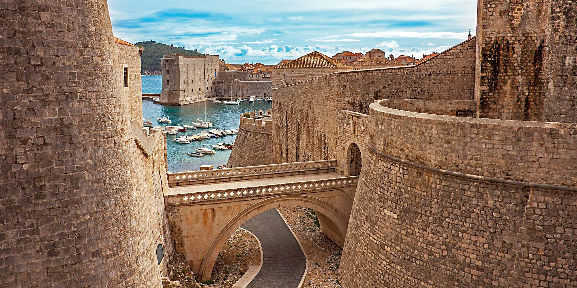 UNESCO World Heritage site of Dubrovnik, rounded city walls and a large bridge