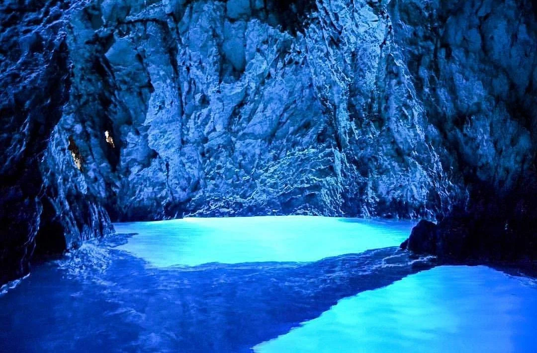 Inside Blue Cave Croatia, with luminescent blue water