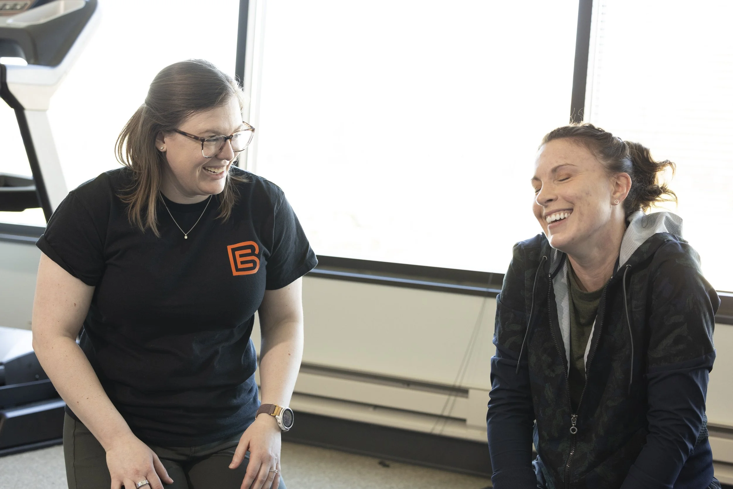 Pelvic floor physical therapist discussing an exercise with a client.