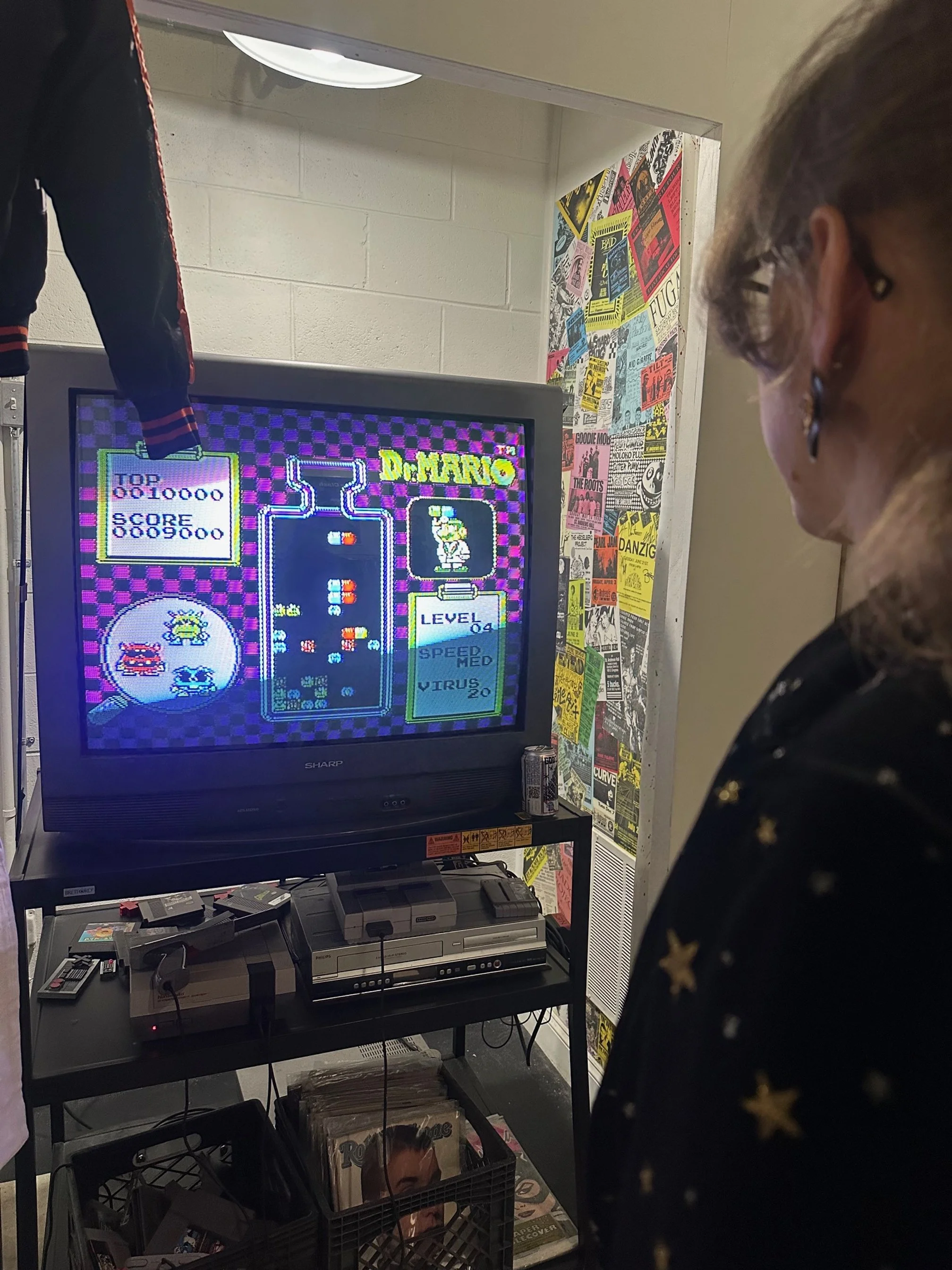Someone plays Dr. Mario on an old television.