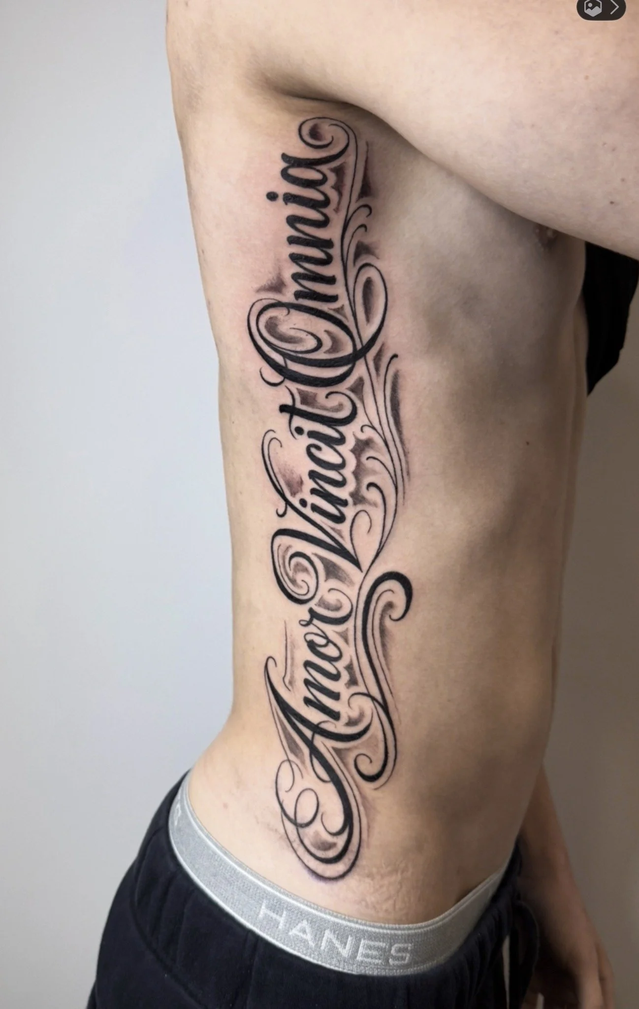 ribs lettering tattoo