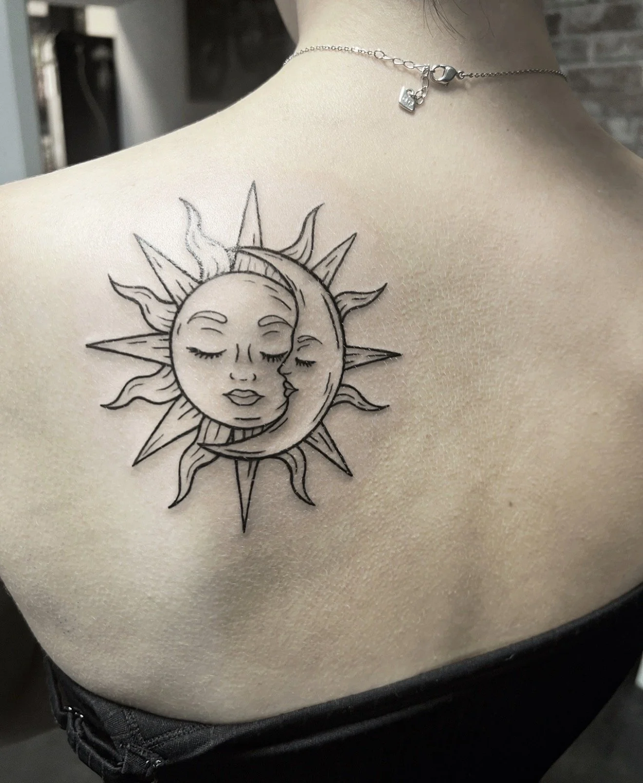 fine line sun and moon tattoo