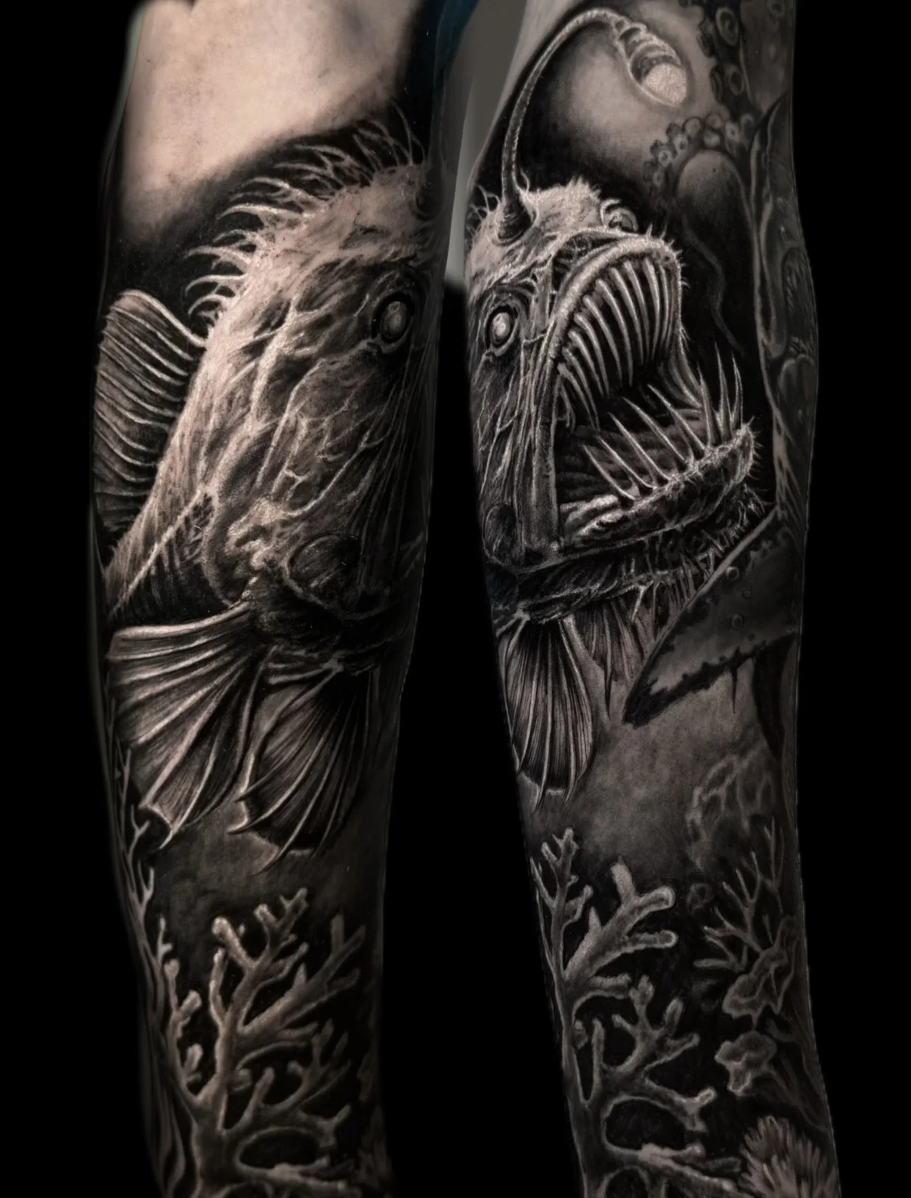 Black and gray tattoo sleeves featuring detailed images of fish, coral, and underwater scenes.