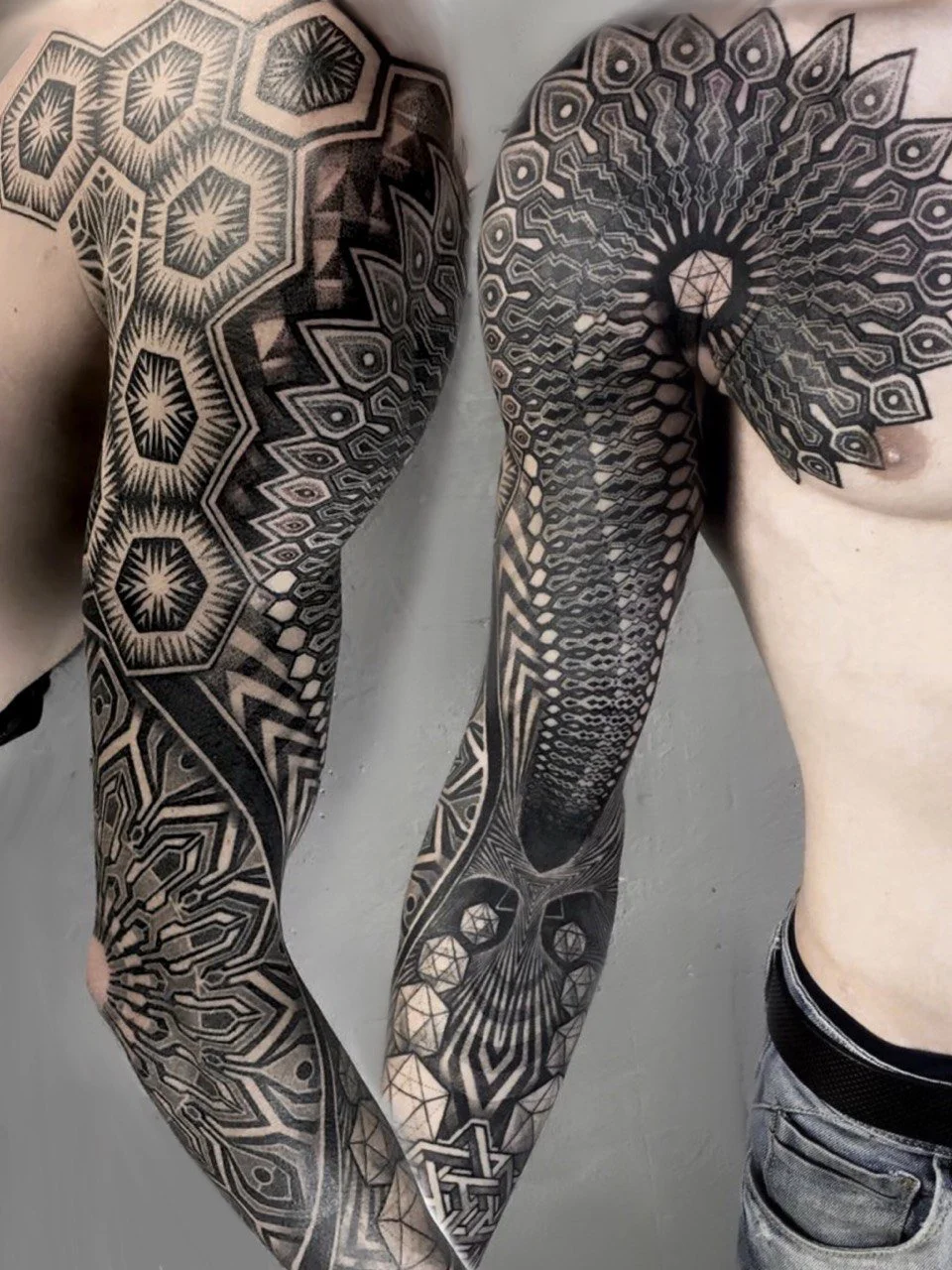 Ornamental geometric dotwork tattoo sleeve with mandala by Tattoo Point, Costa Mesa