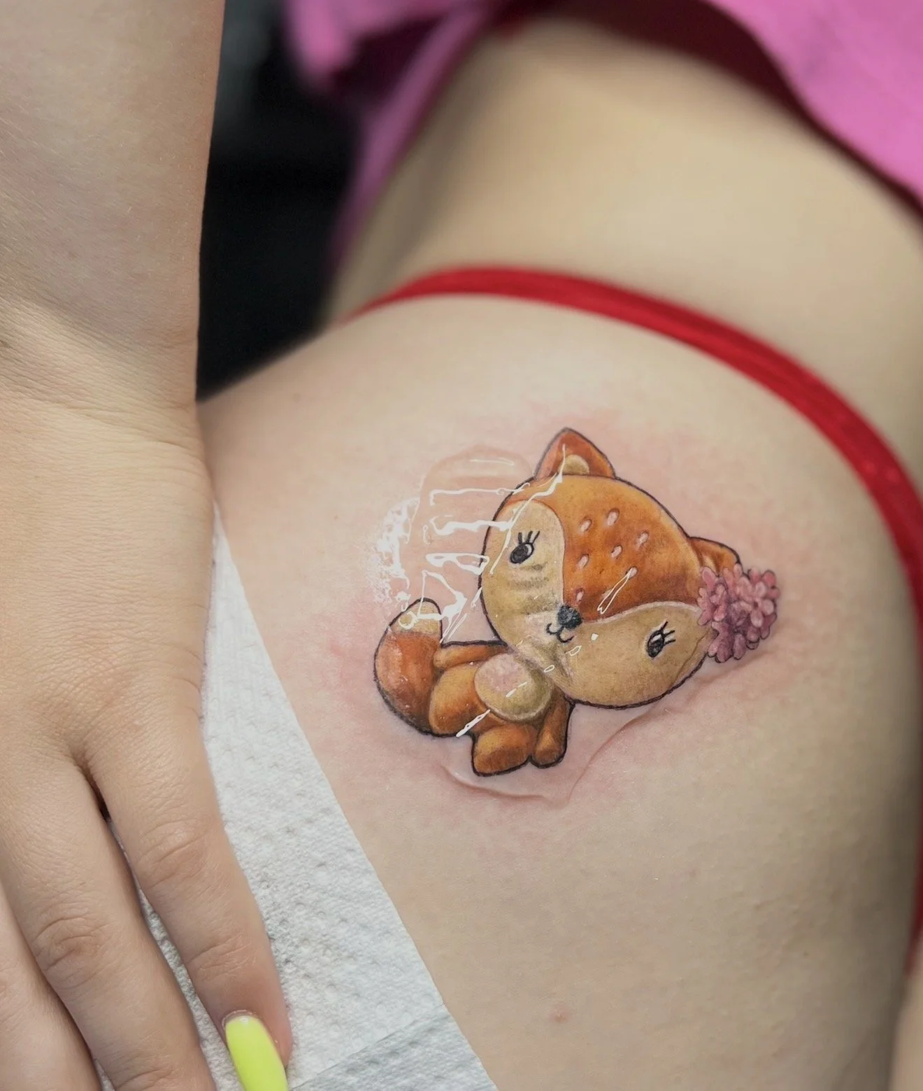 Cute fox cartoon tattoo on thigh