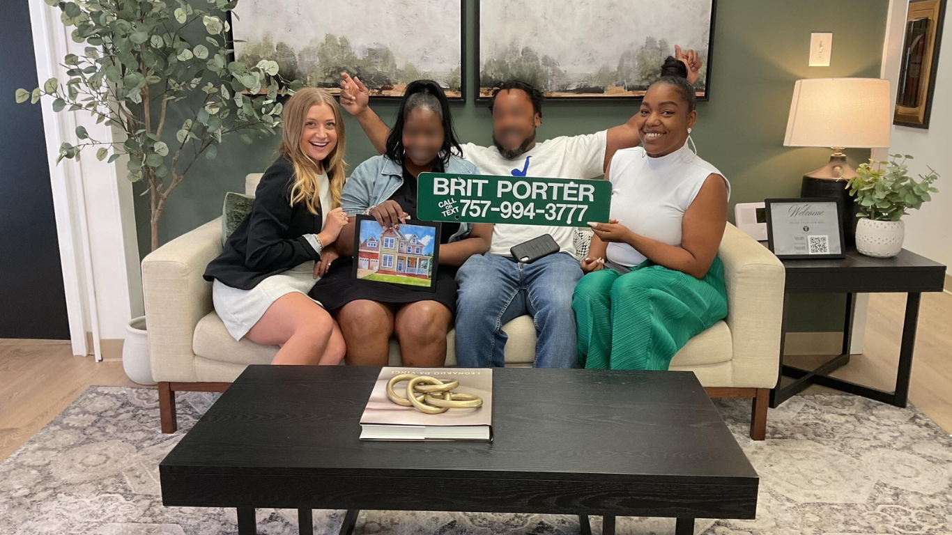 Happy homeowners celebrate their successful home purchase with Brit Porter, Hampton Roads' trusted real estate expert. Specializing in luxury, relocation, and investment properties, Brit Porter delivers seamless buying experiences.
