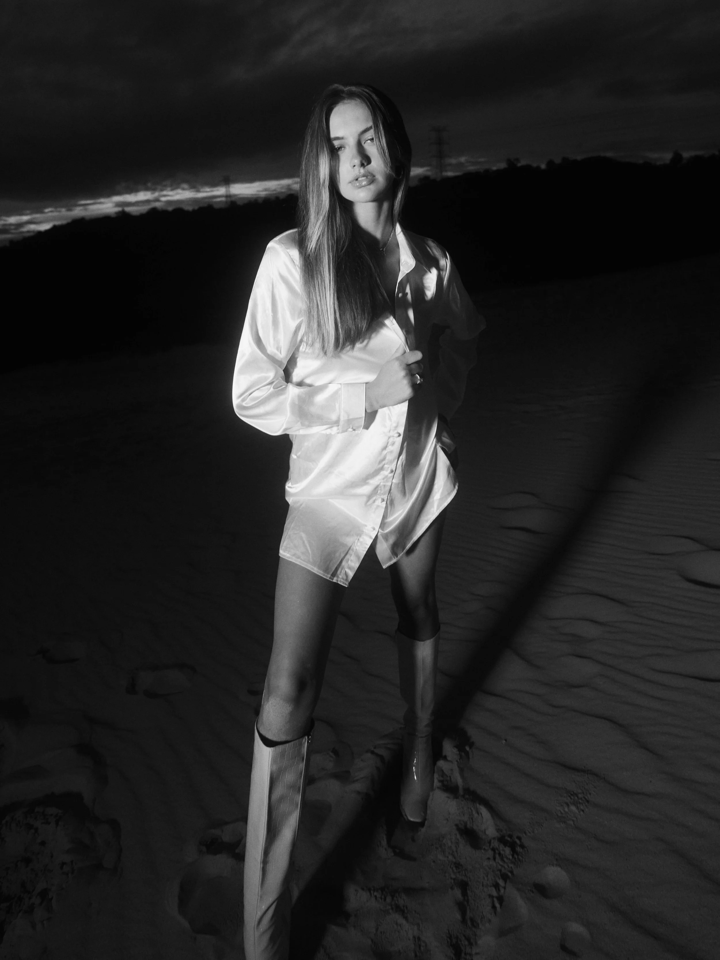 Professional ARRI digital cinema camera with black body and mounted lens, isolated on black background.