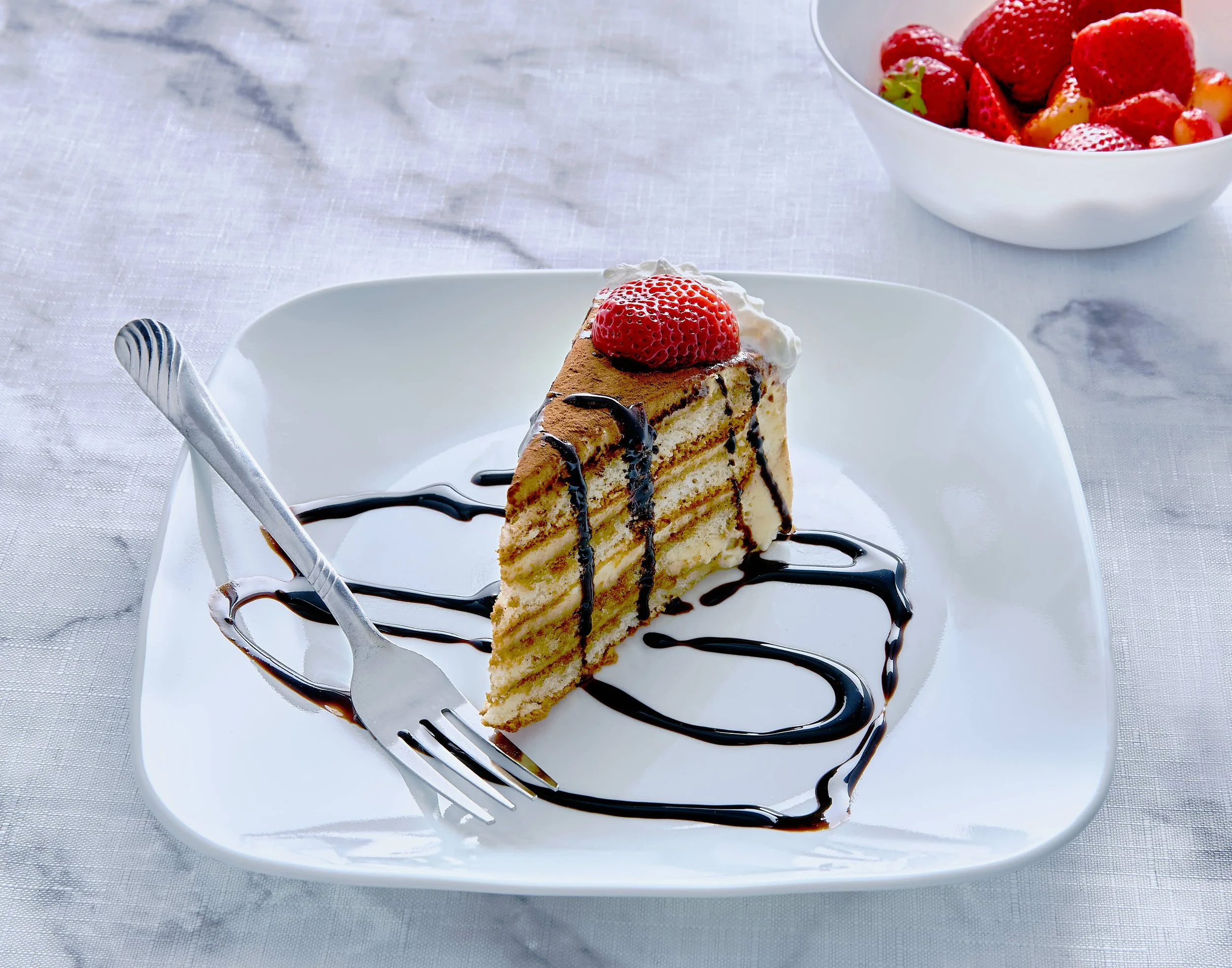 Commercial food photograph of a decorated cake by Obscura Dreams