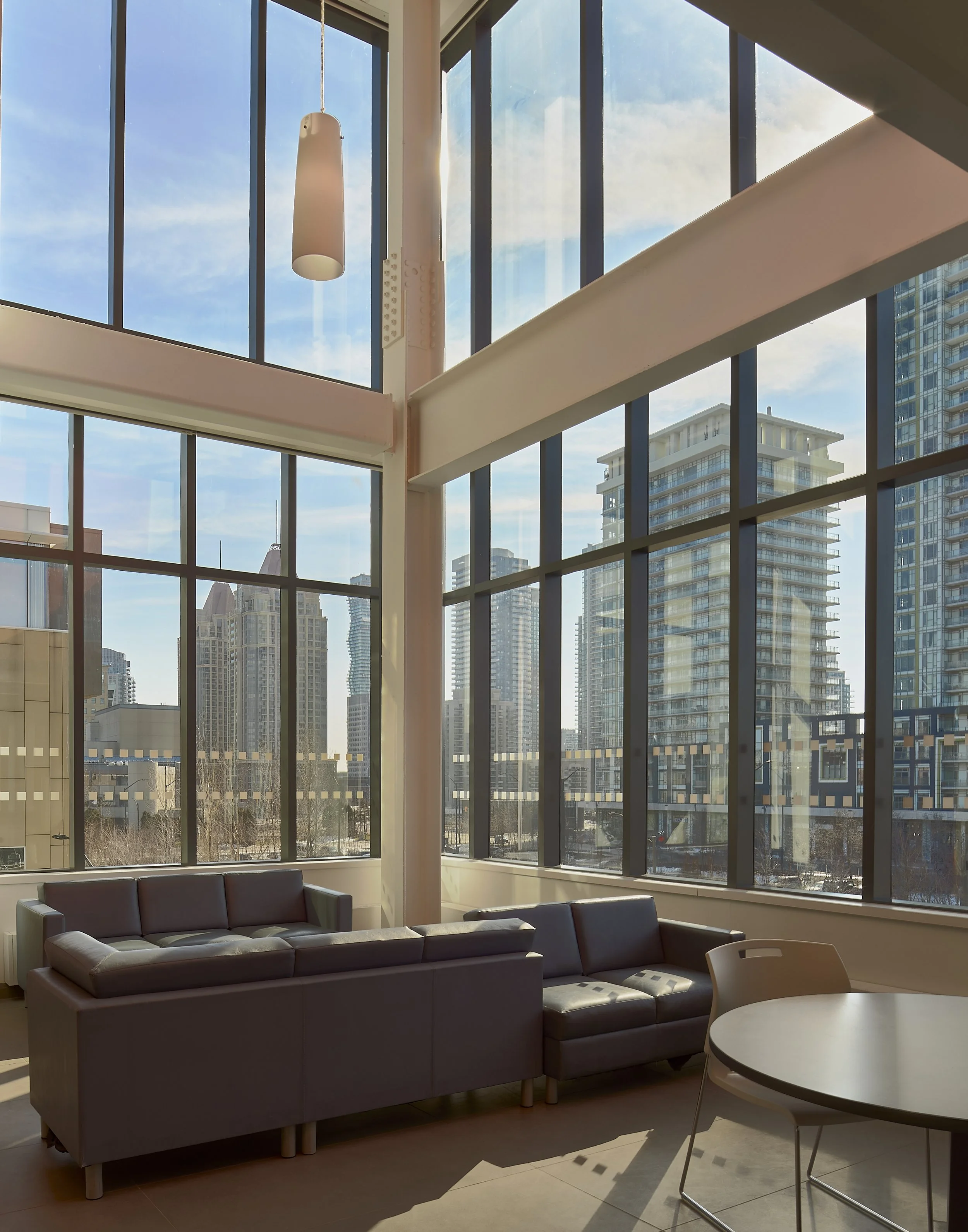 Amenity lounge with city view photographed by Obscura Dreams