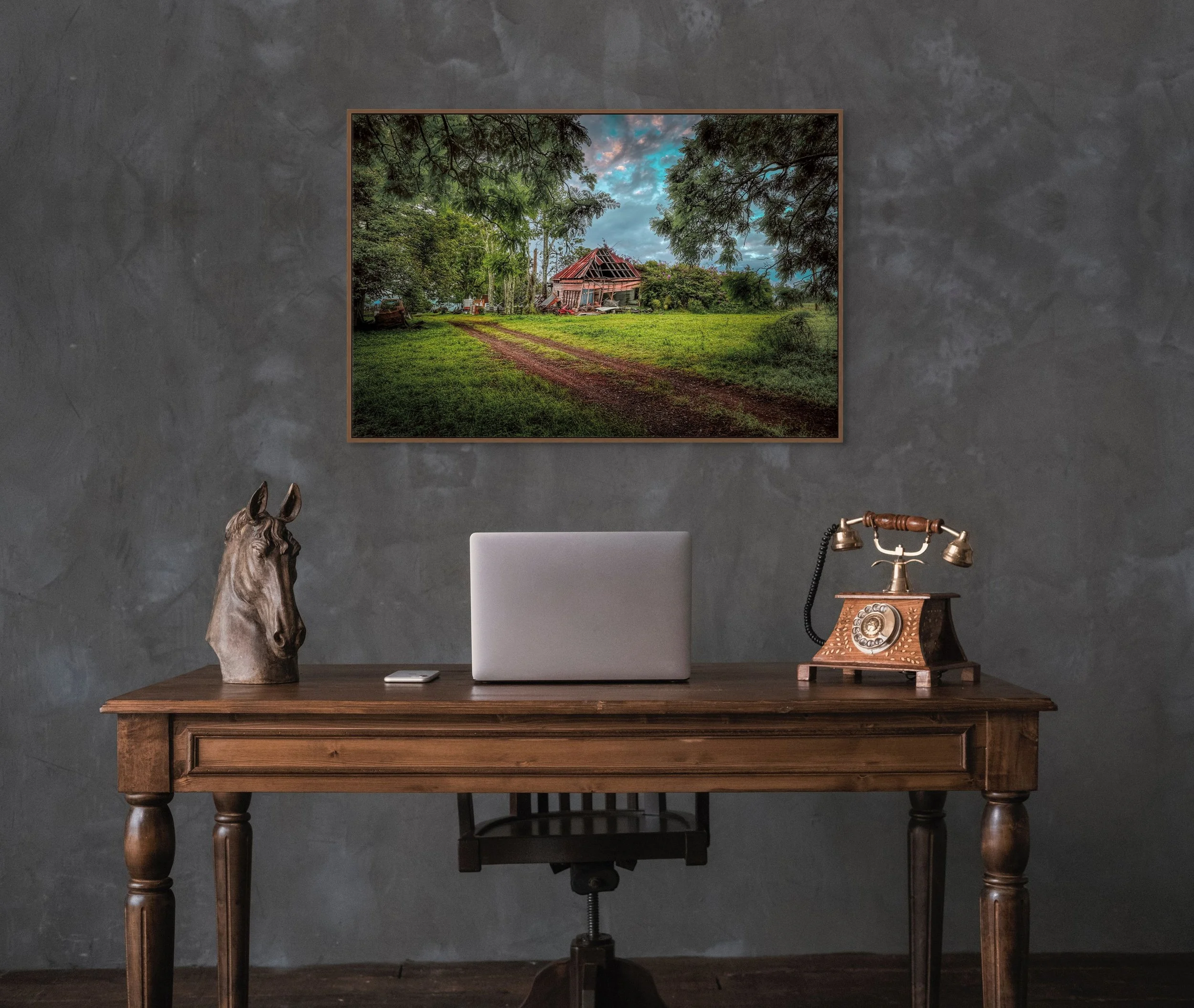 Old abandoned farmhouse surrounded by trees and countryside landscape.