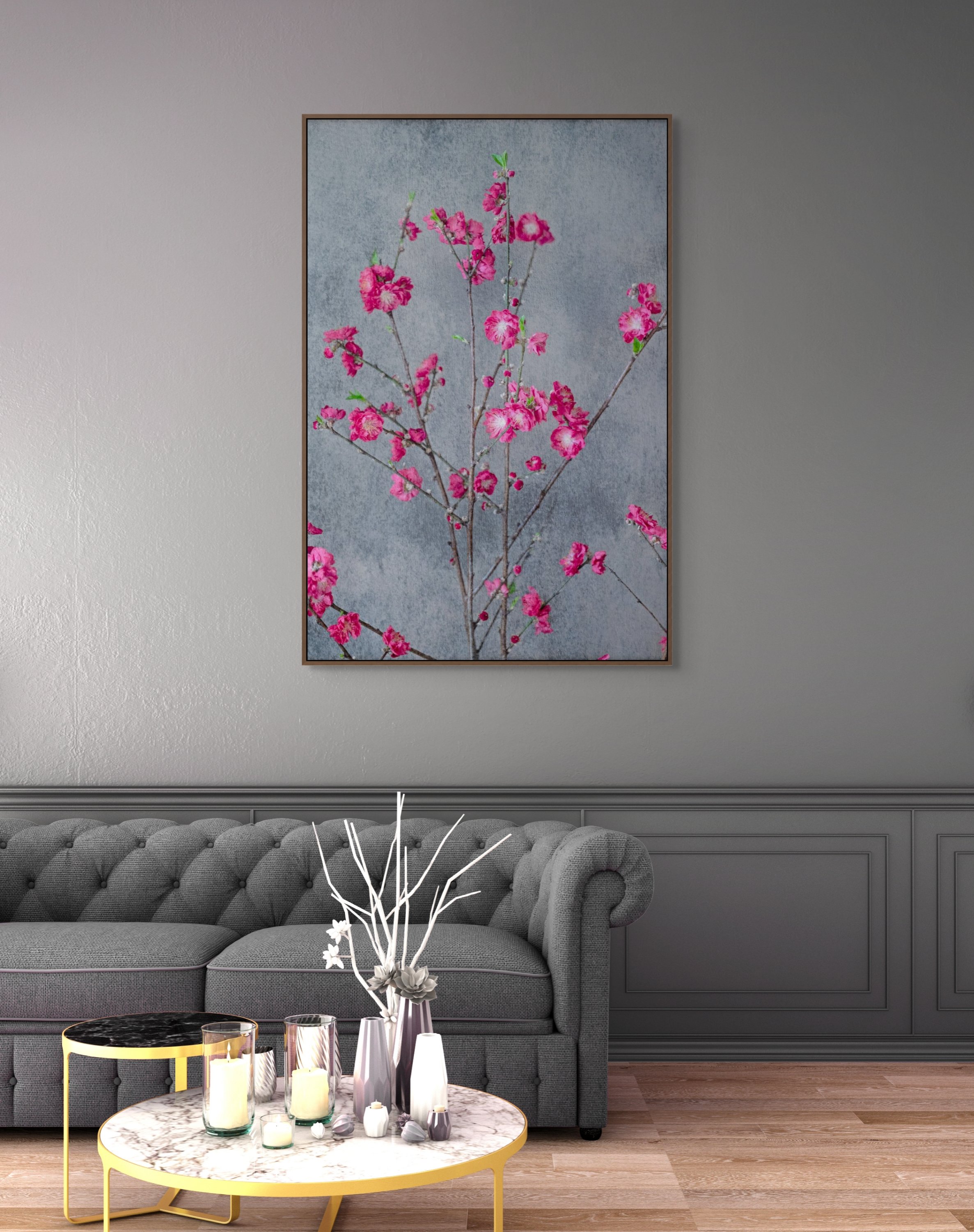 Bright pink blossom branches against a soft textured grey background.