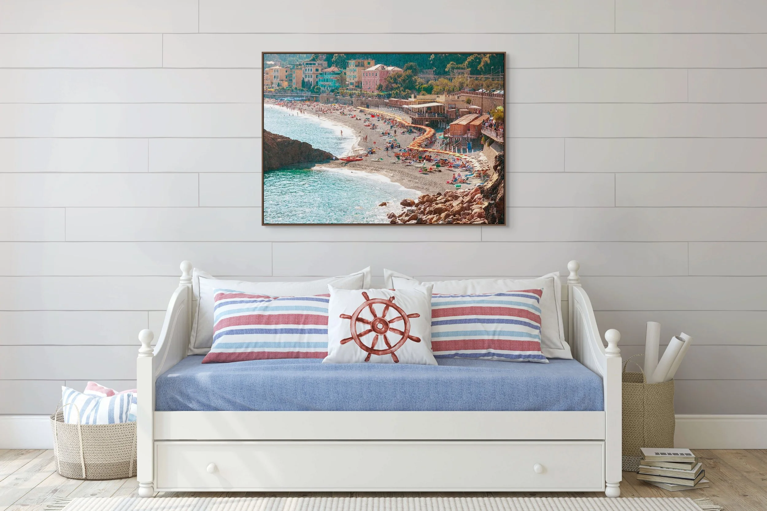 Cinque Terra beach, where rows of bright umbrellas and loungers form a lively patchwork against the soft gray sand.