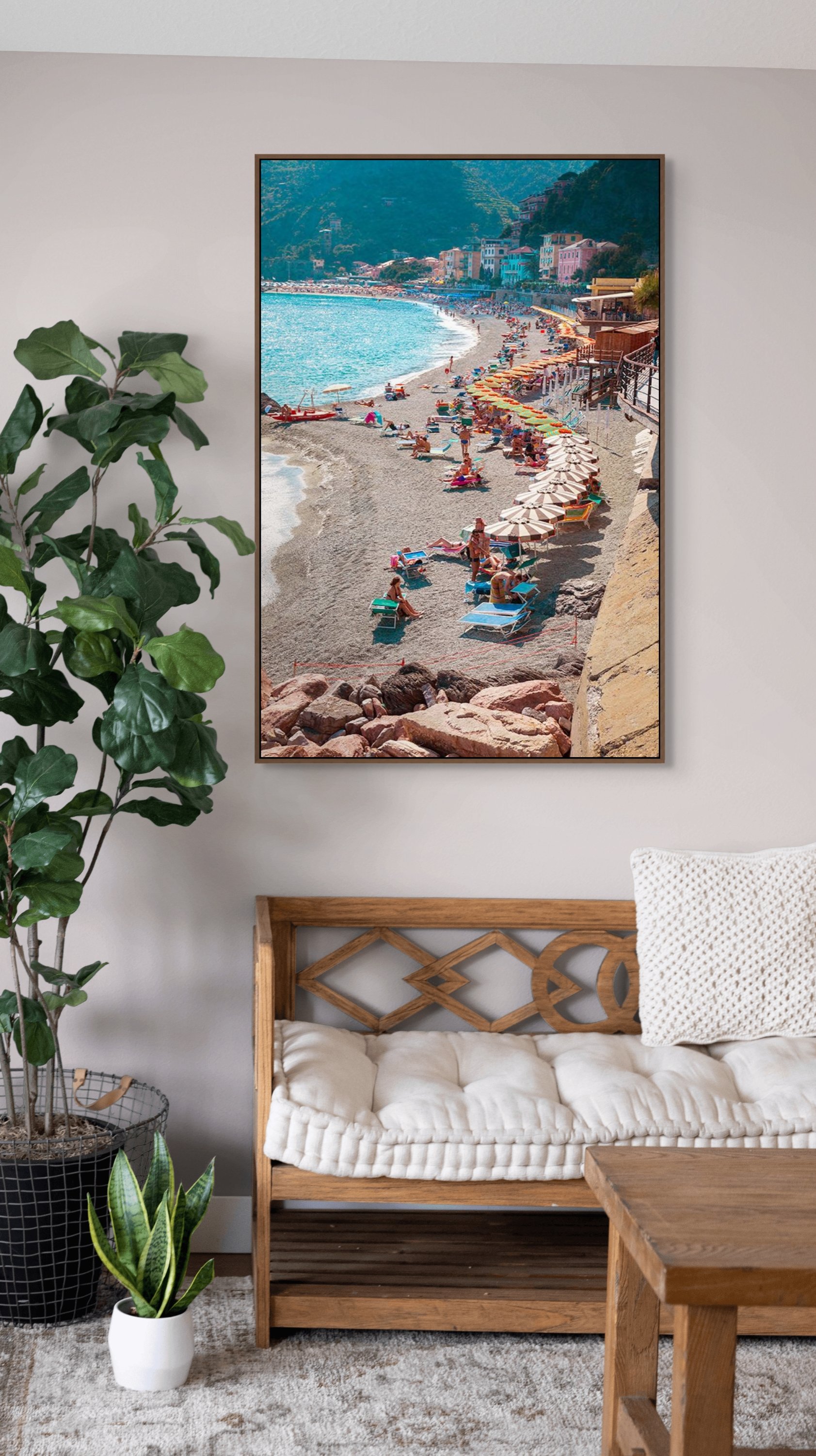 Captures the colourful energy of a sun-soaked seaside in Cinque Terra, where rows of bright umbrellas and loungers form a lively patchwork against the soft grey sand
