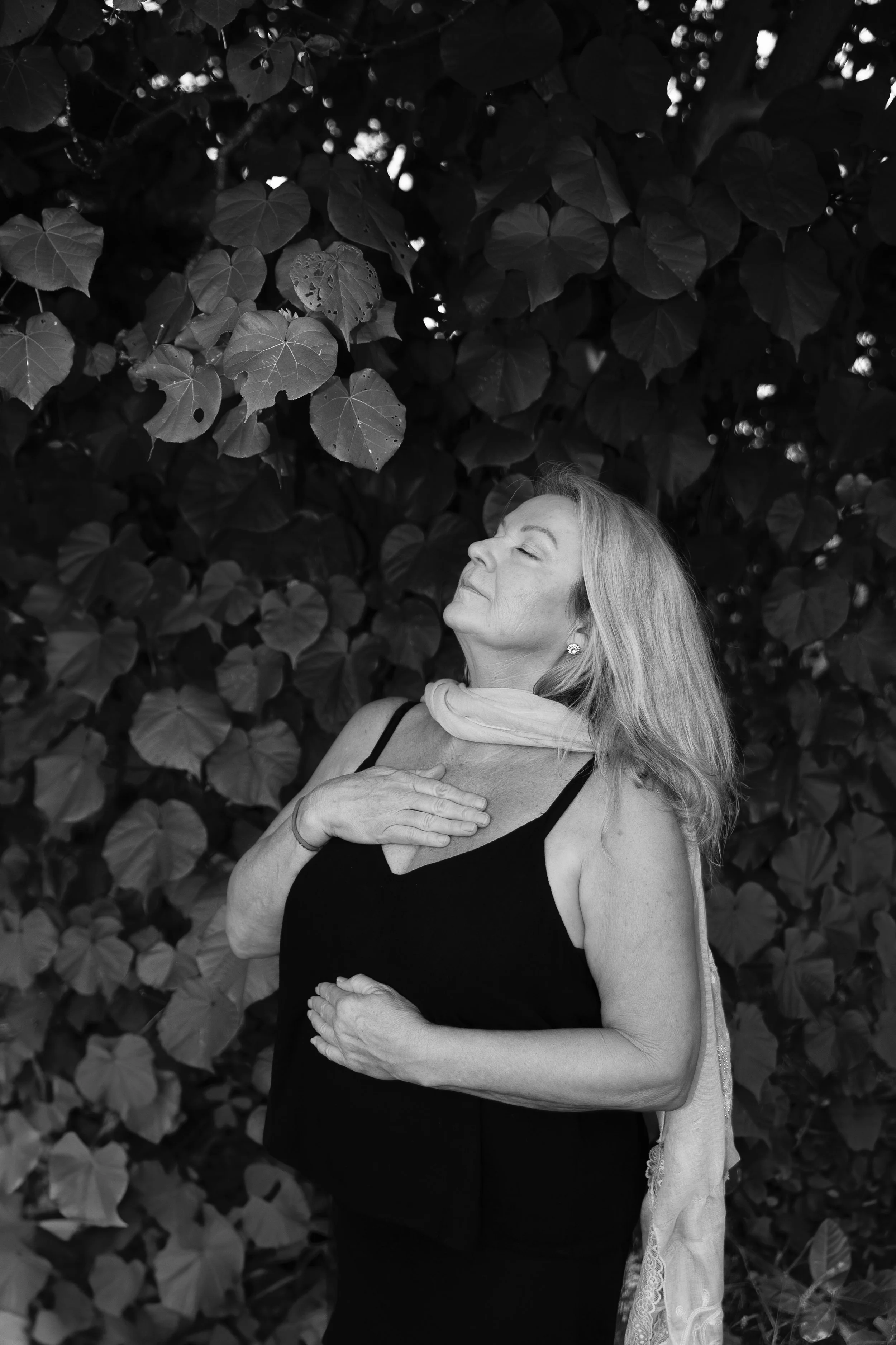 Karen Williams, holistic wellness practitioner, in a calm natural setting
