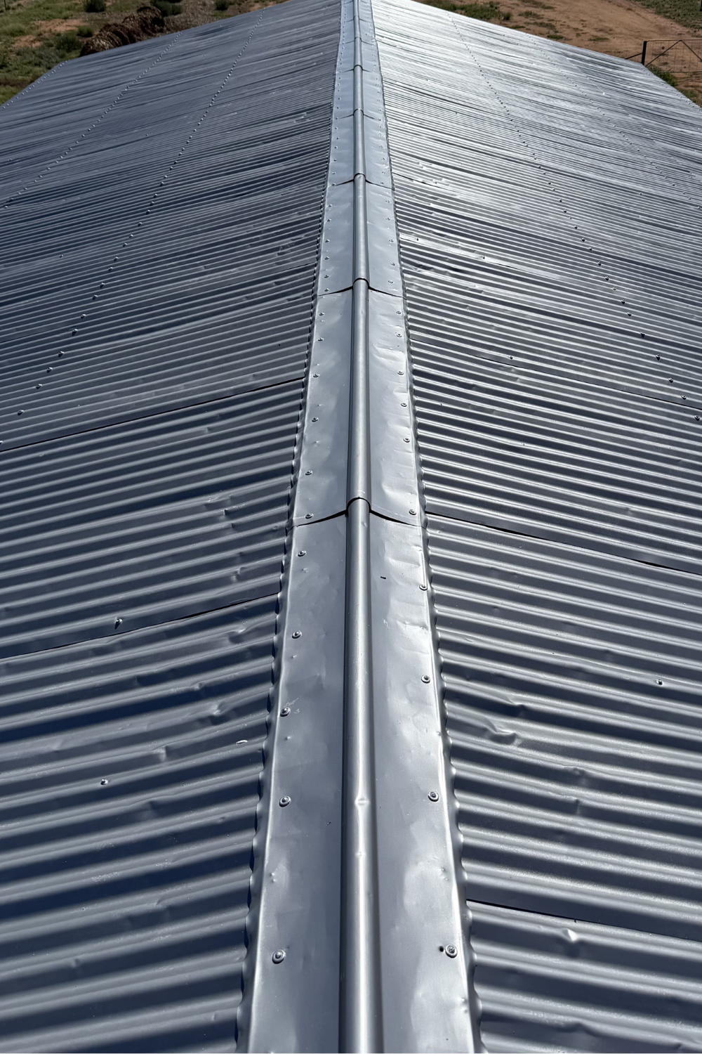 A gray metal roof in Bluff after painting grey.