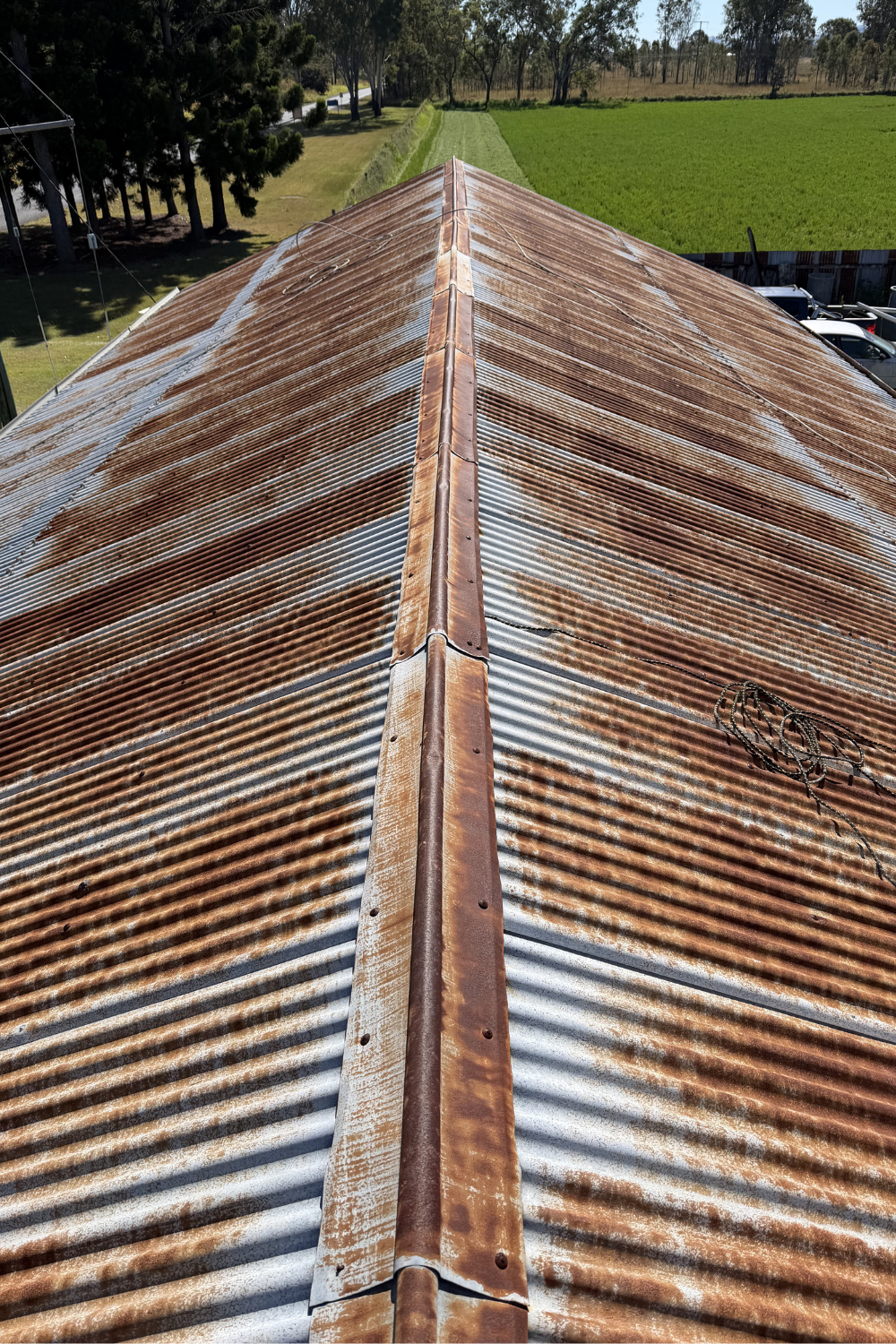 A rusty metal roof in Emerald, Queensland prior to painting.