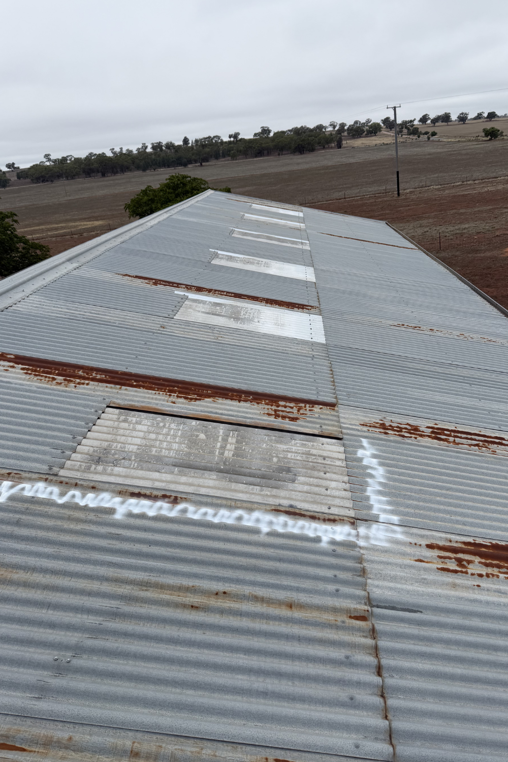 A rusty metal roof in Thallon prior to painting.