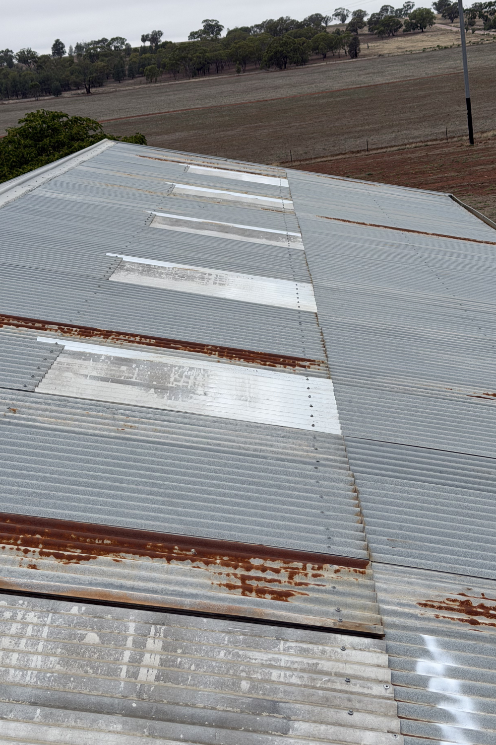 A rusty metal roof in Injune prior to painting.