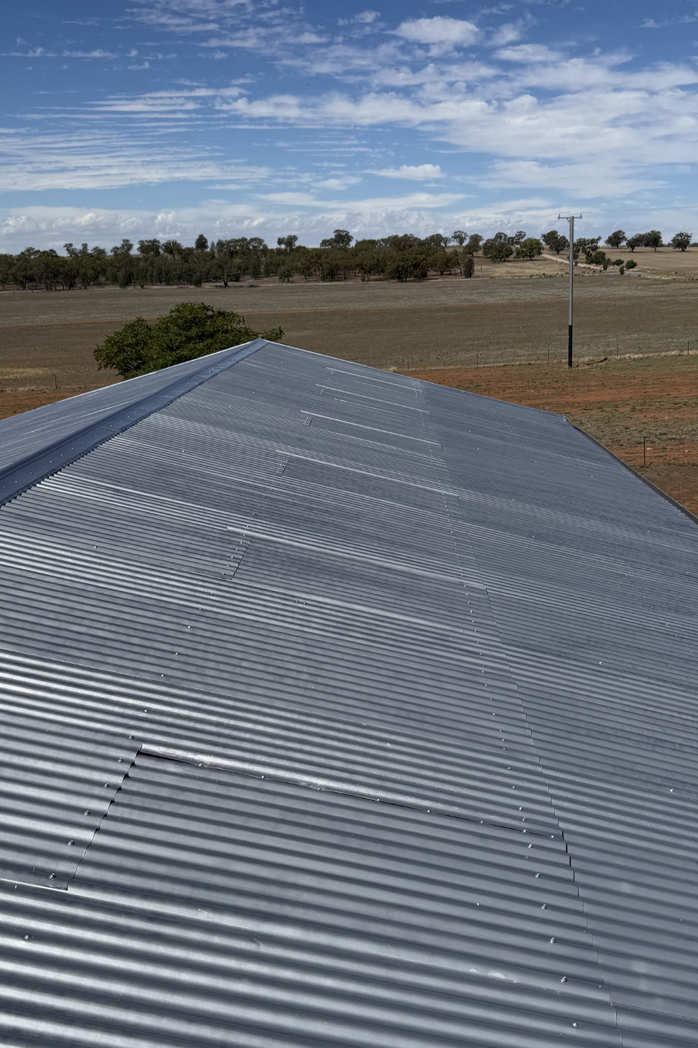A freshly painted metal roof in Thallon after painting grey.