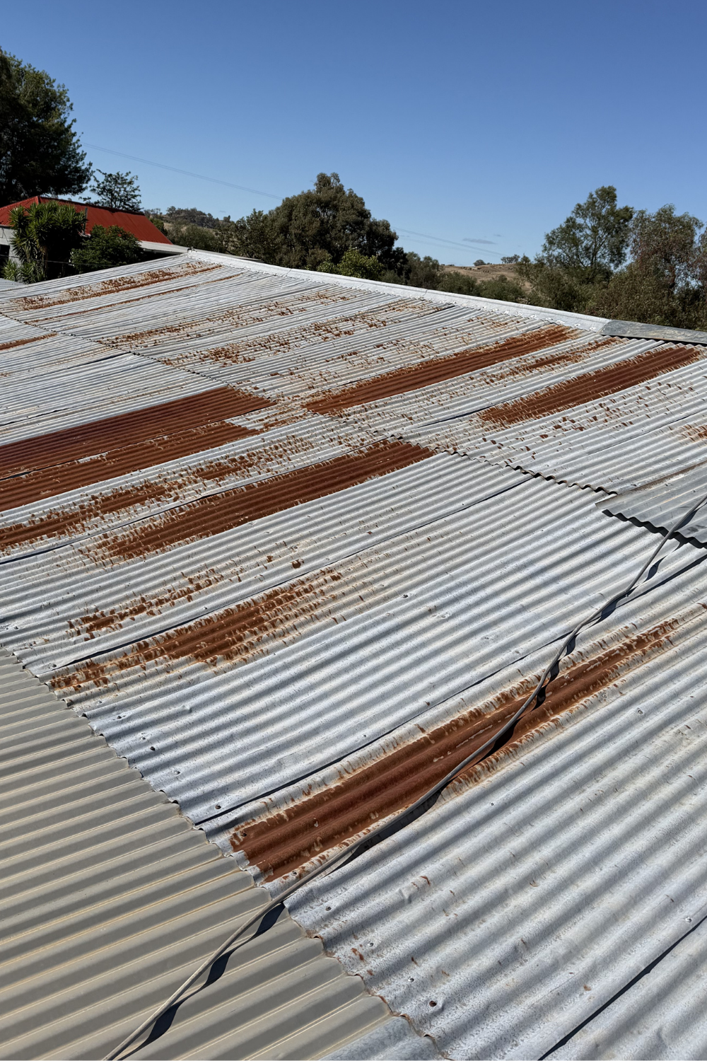 A rusty metal roof in Prospect prior to painting.
