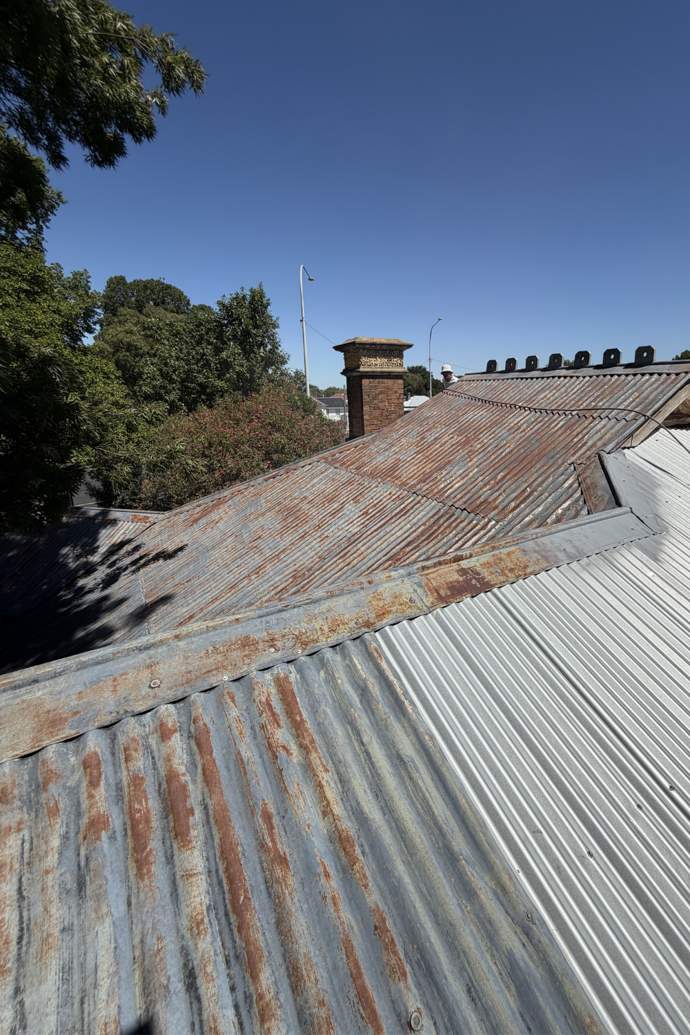 A rusty metal roof in Eurombah prior to painting.