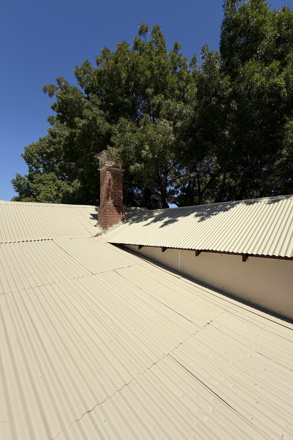 A freshly painted metal roof in Cracow after painting yellow.