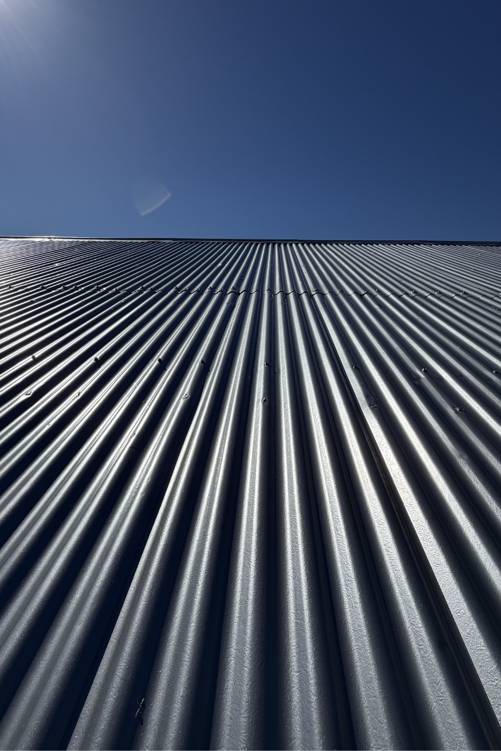 A freshly painted metal roof in Taroom after painting grey.