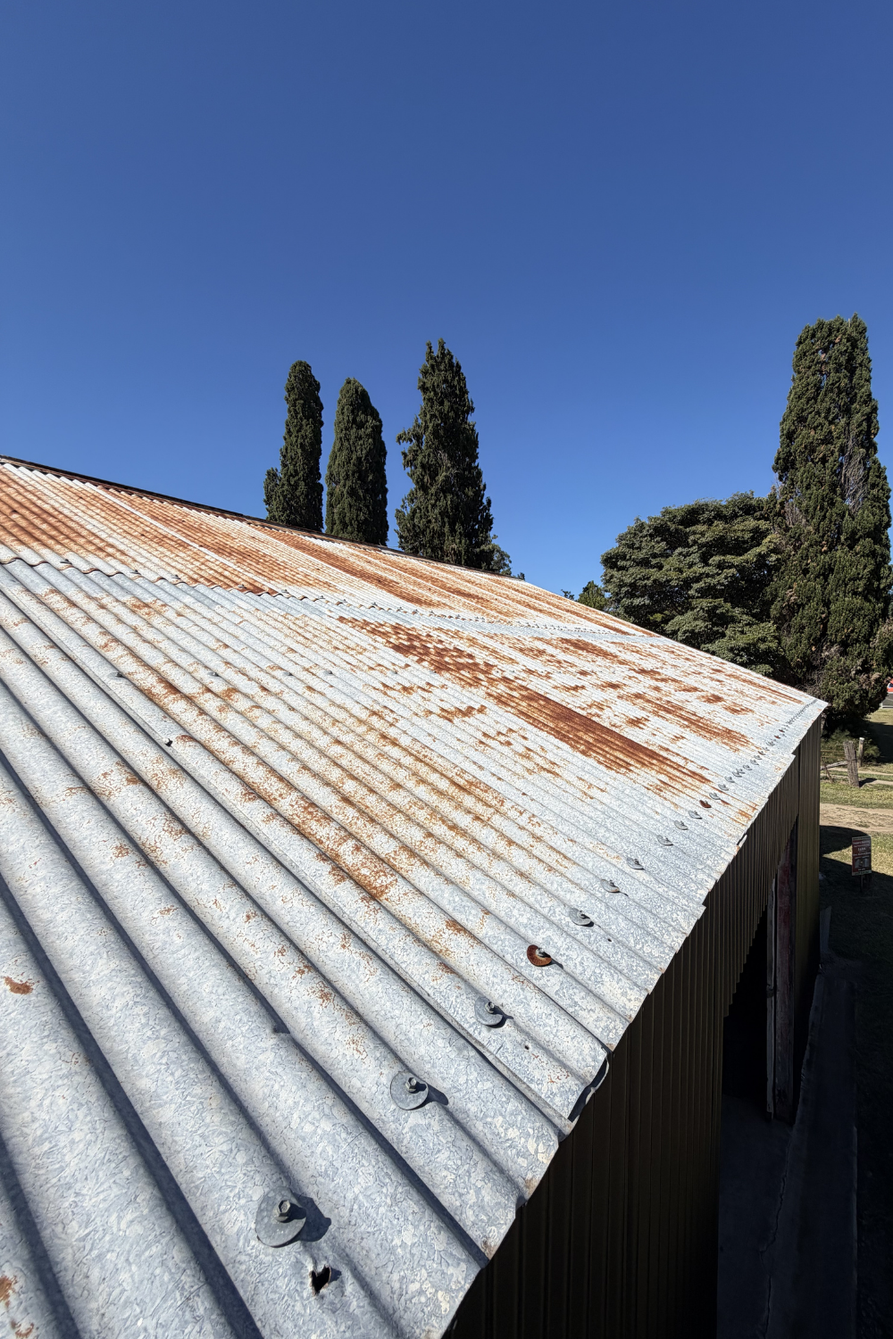A rusty metal roof in Sapphire Central prior to painting.