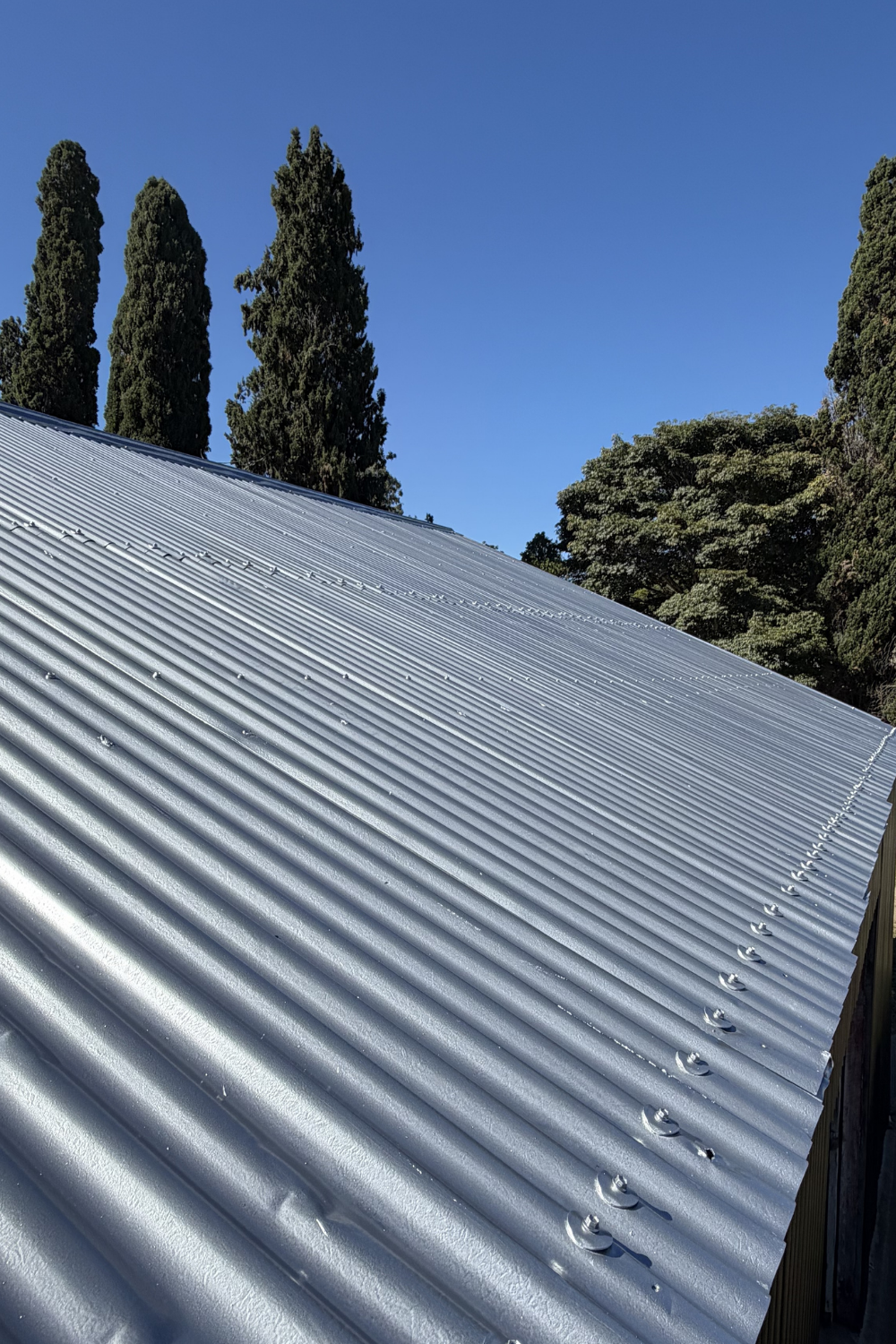 A freshly painted metal roof in Sapphire Central Gemfields after painting grey.